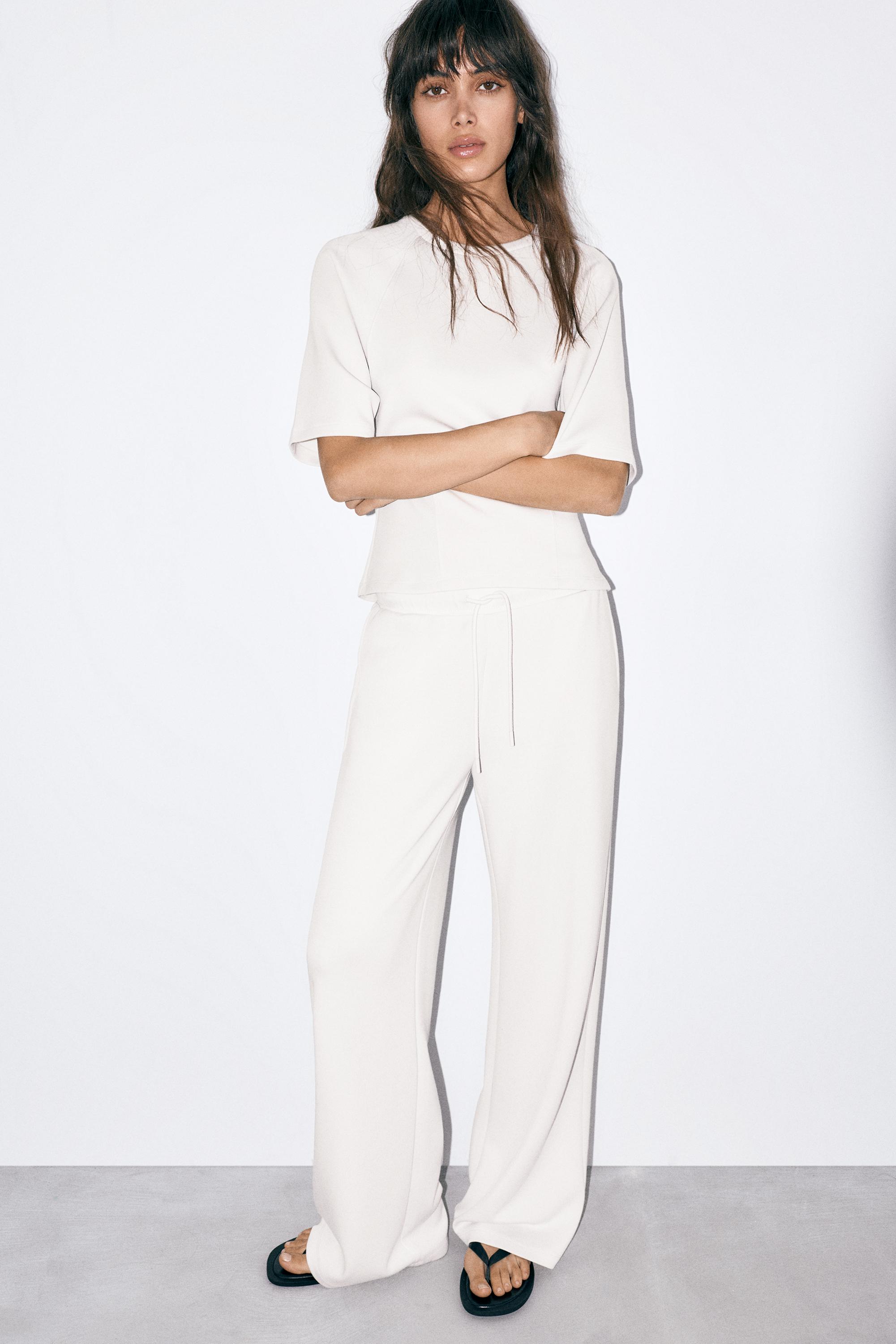 Soft-touch wide-leg trousers — Ecru