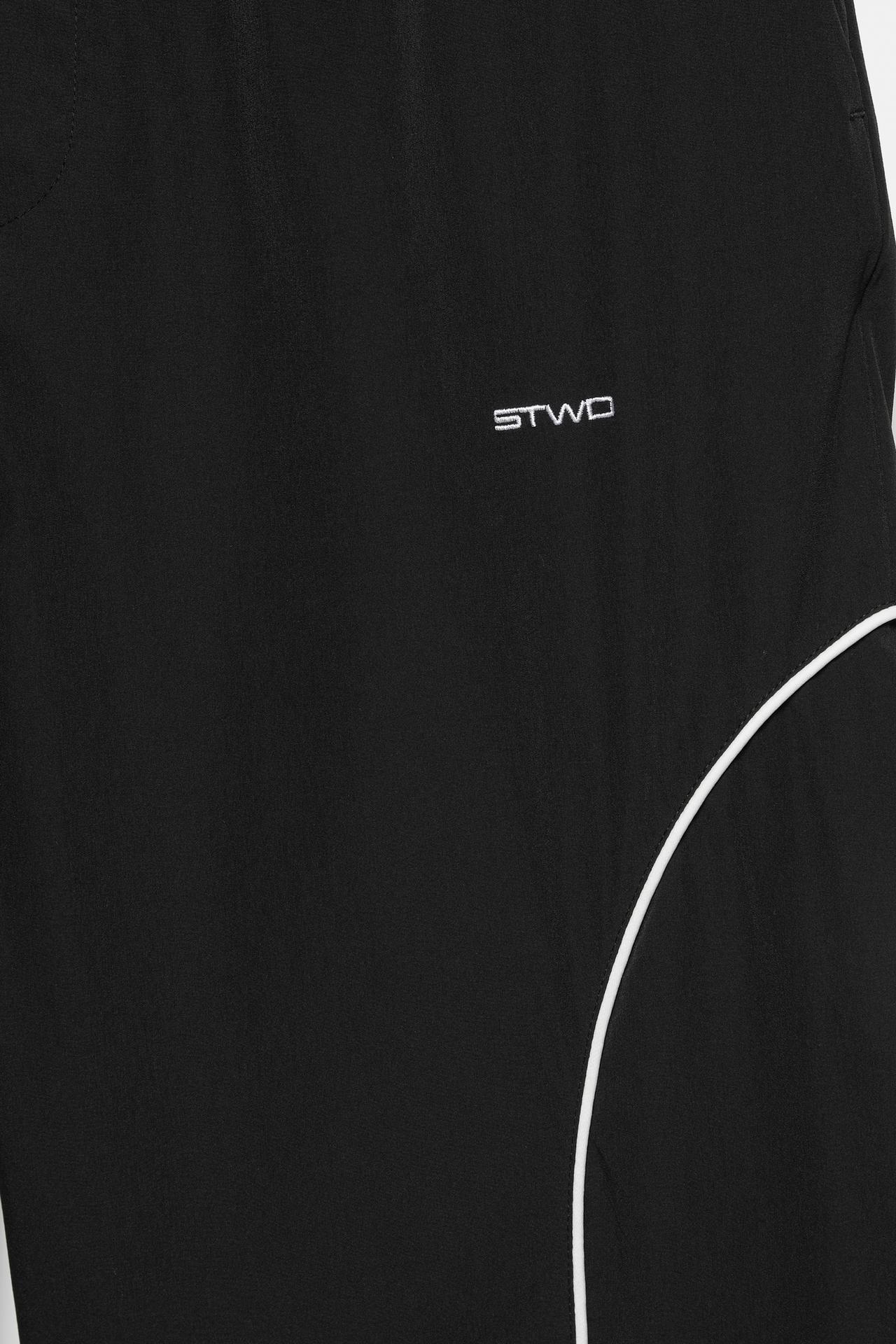 Technical jogger trousers with piping — Black