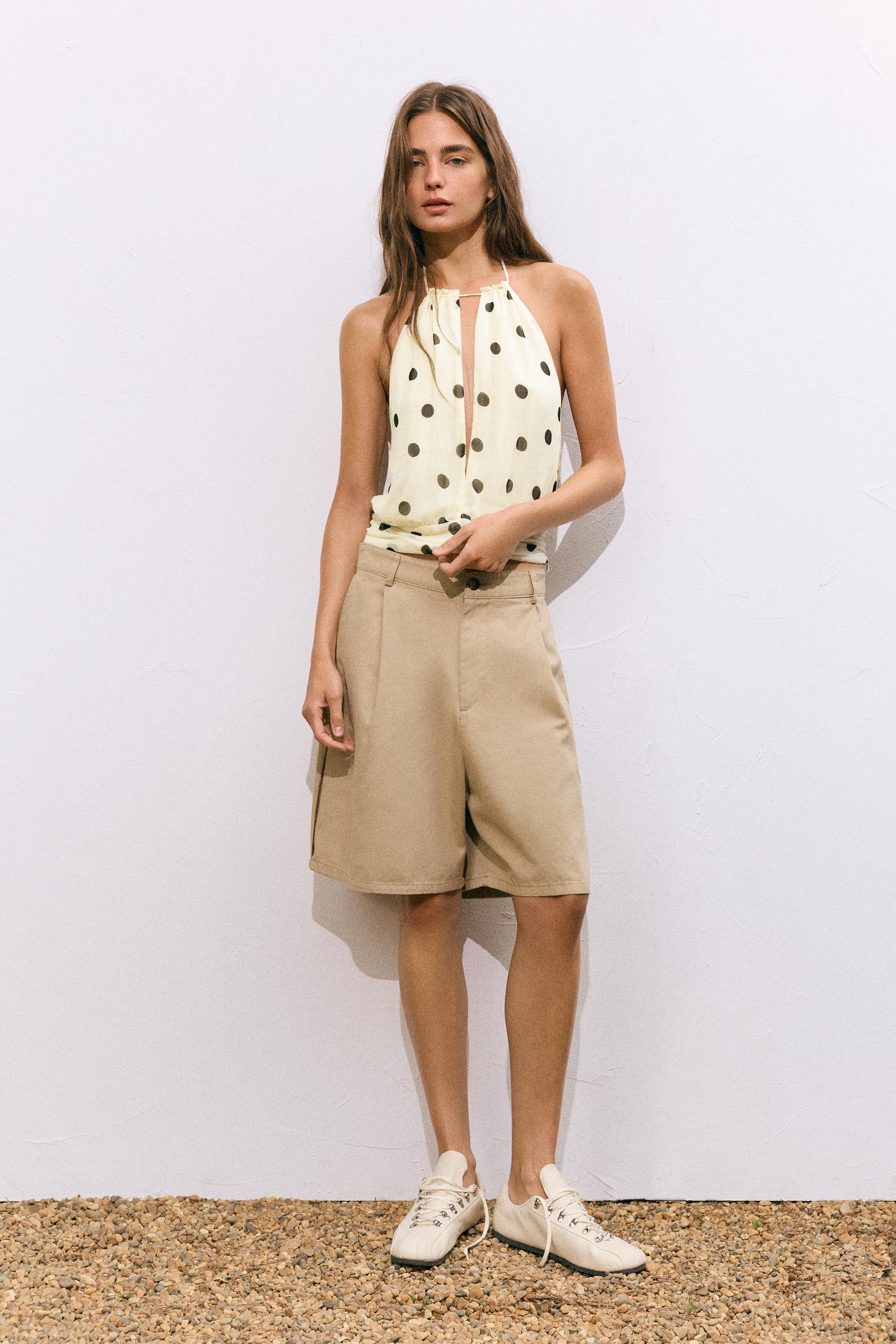 Polka dot halter top with cutout — White