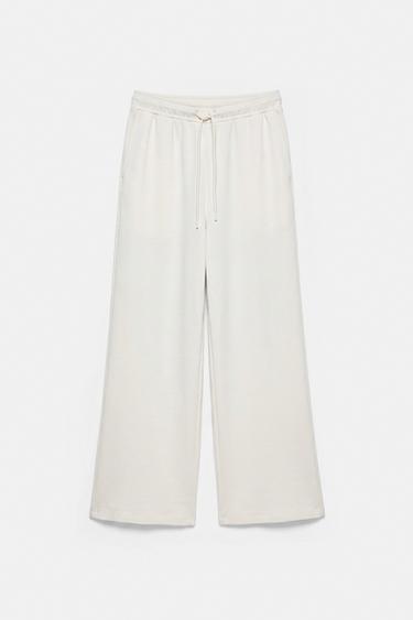 Soft-touch wide-leg trousers — Ecru 1