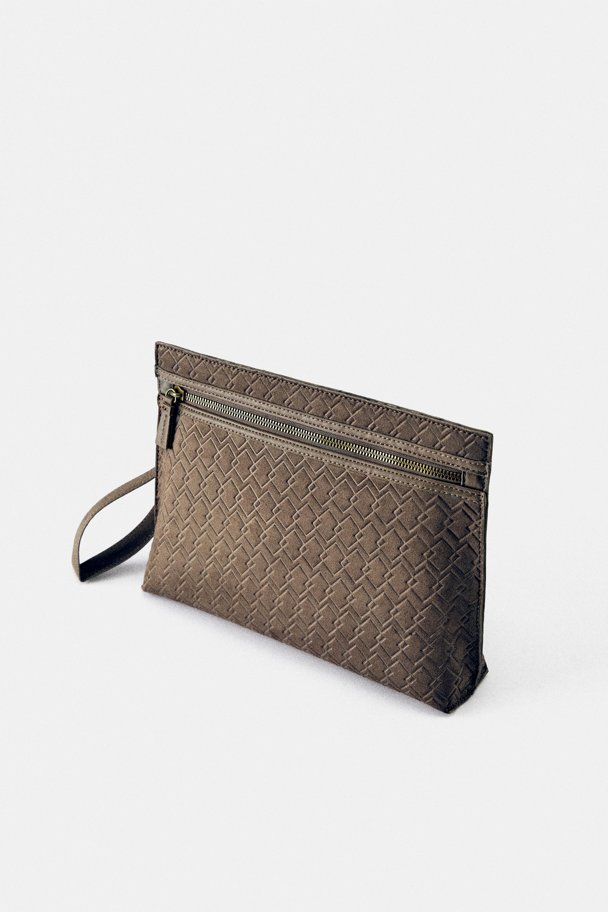 Embossed handle clutch bag — Brown