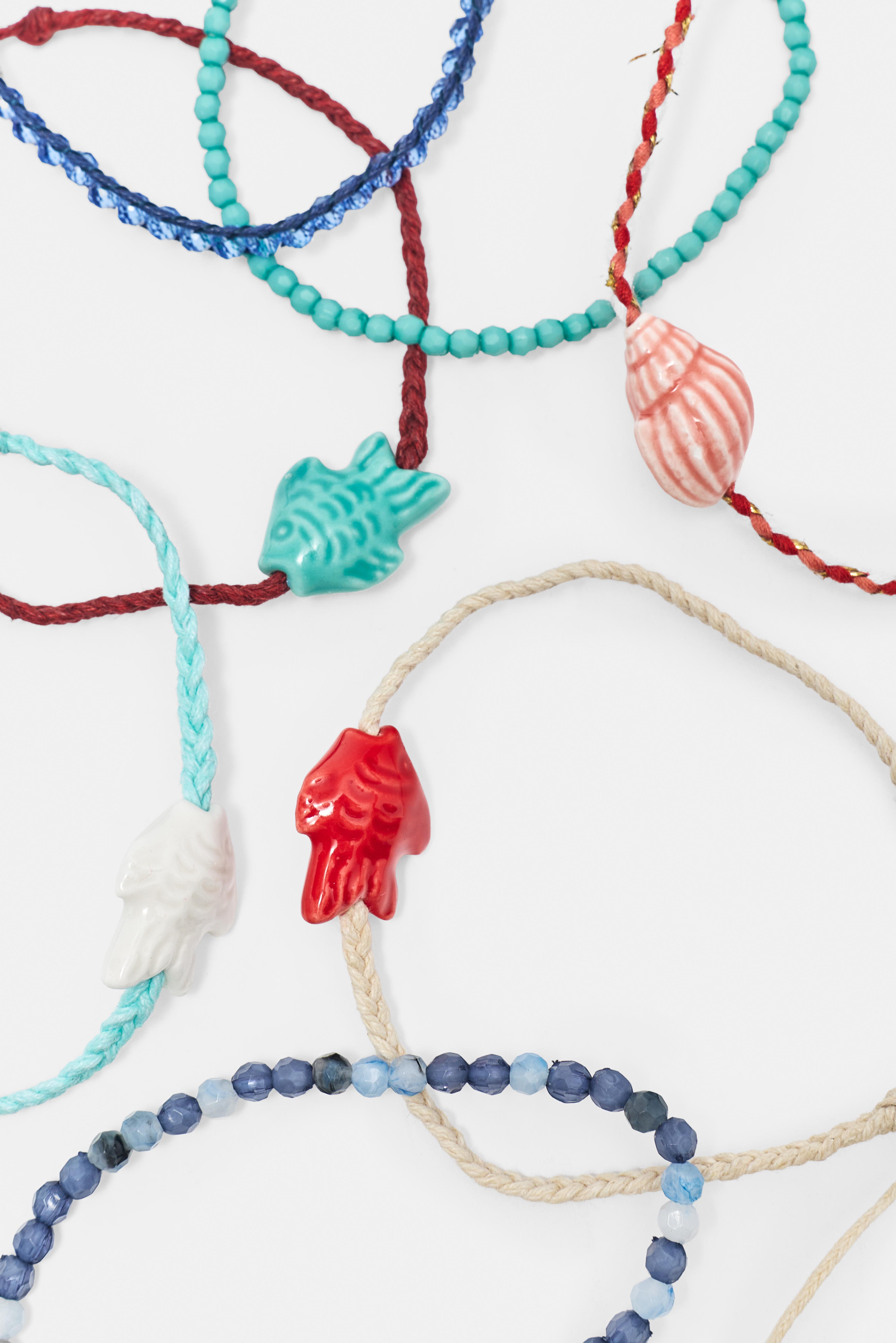 Pack of 7 fish charm bracelets — Blue