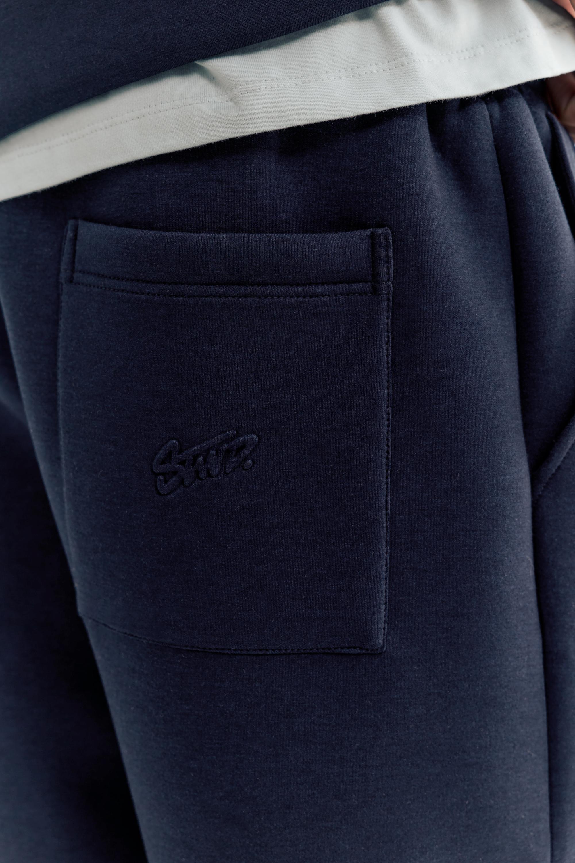 Neoprene-effect baggy trousers — Navy