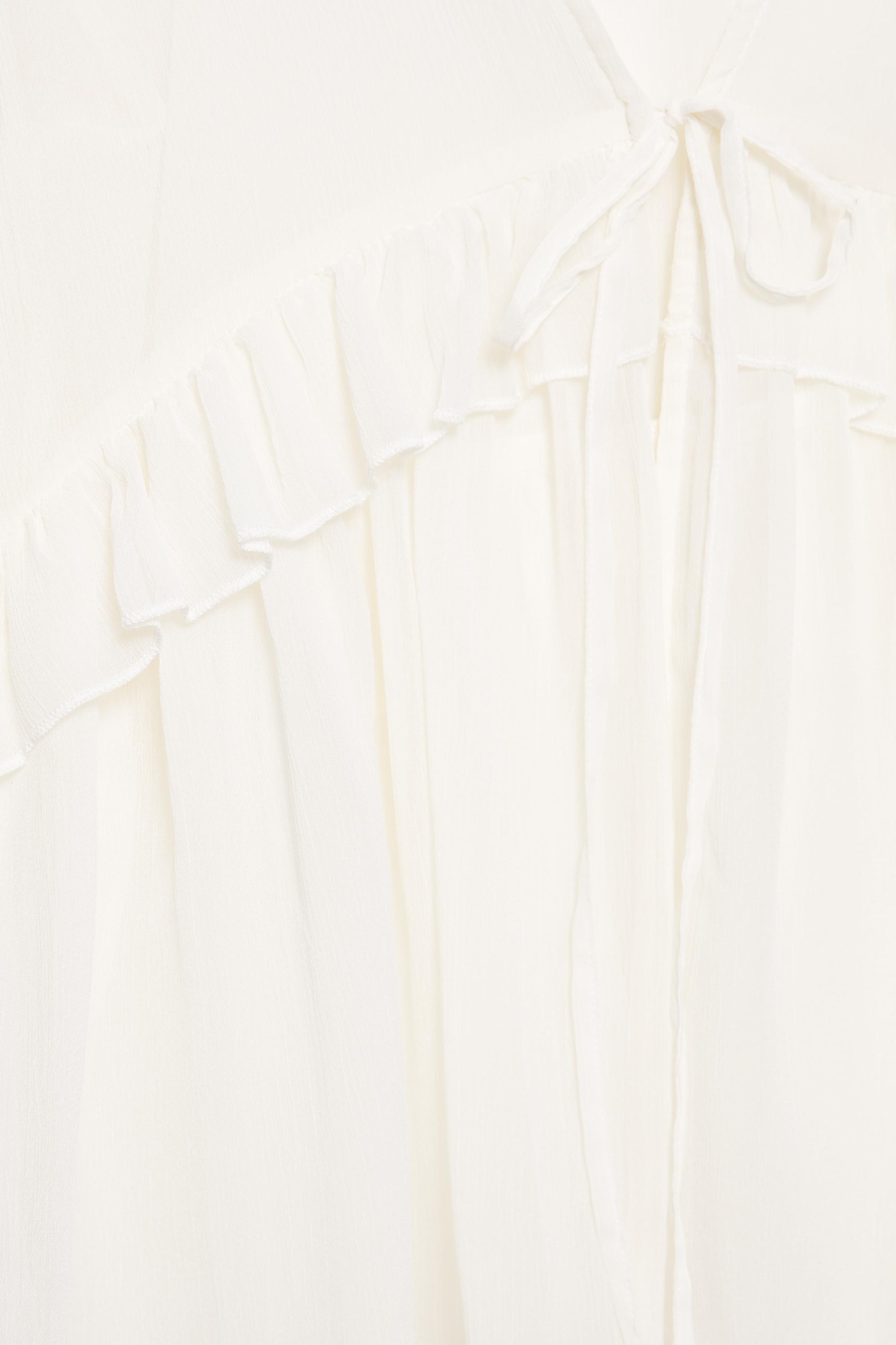 Sheer blouse with ruffle — Ice