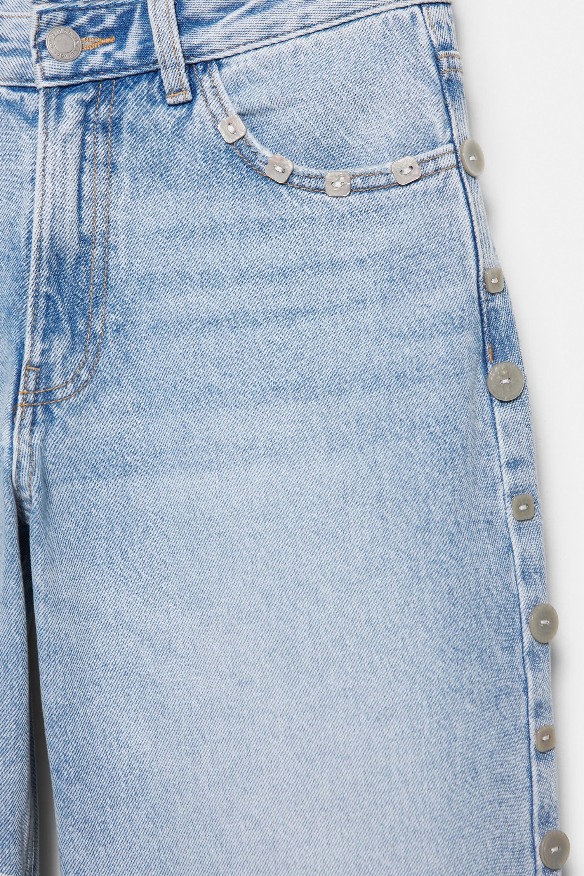 Baggy jeans with button detail