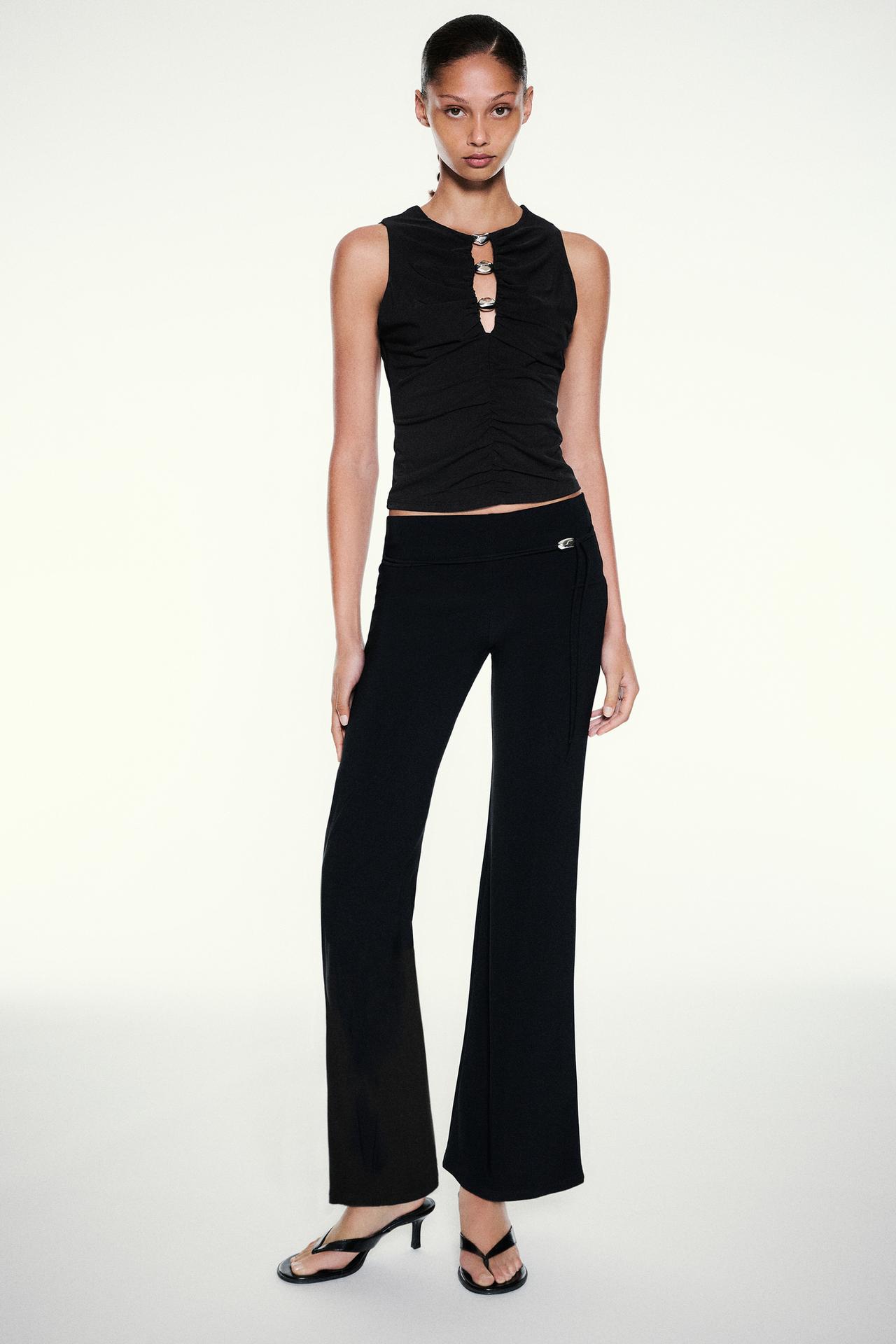 Cut-out embellished top — Black