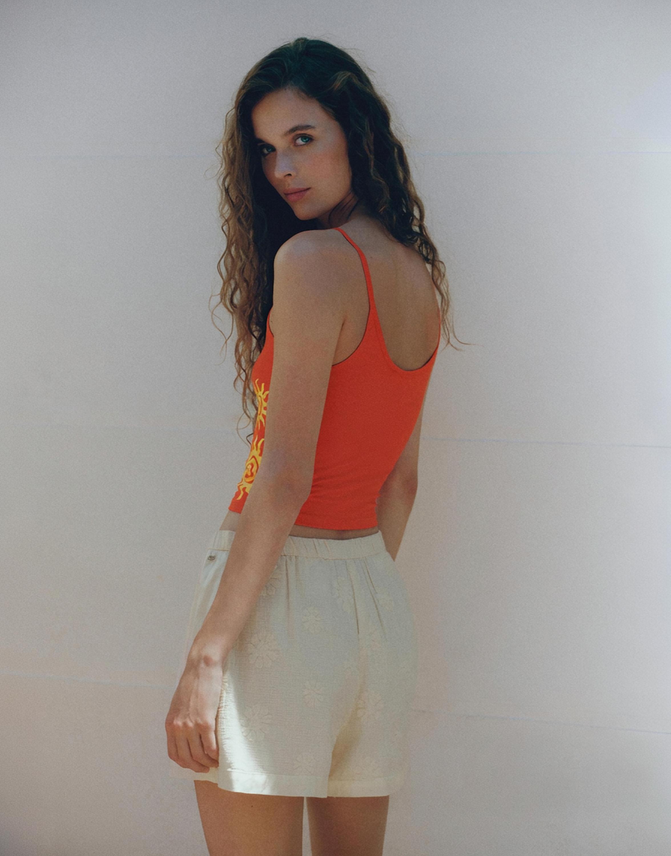 Orange sun graphic top — Red