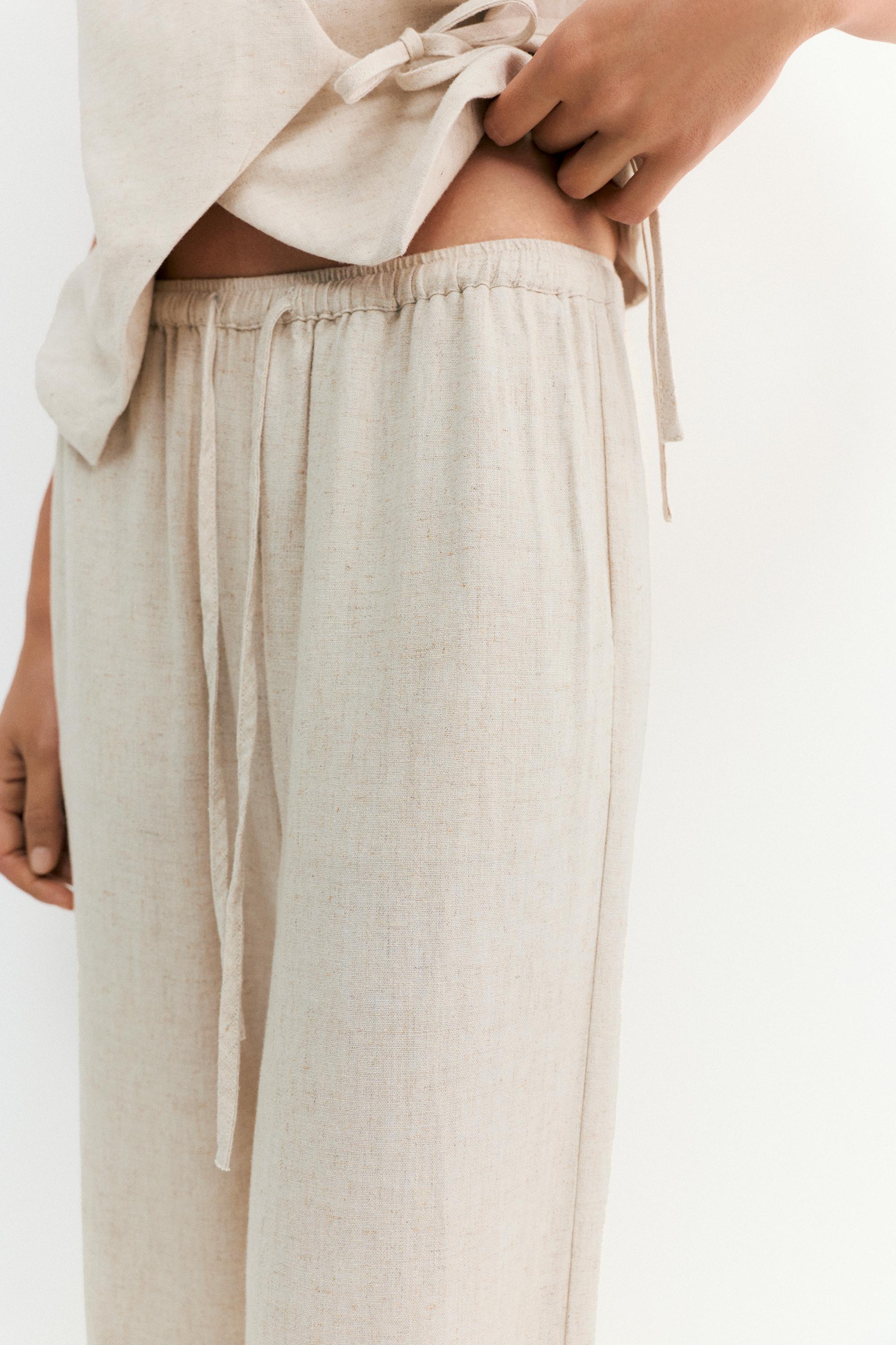 Flowy trousers with linen — Beige