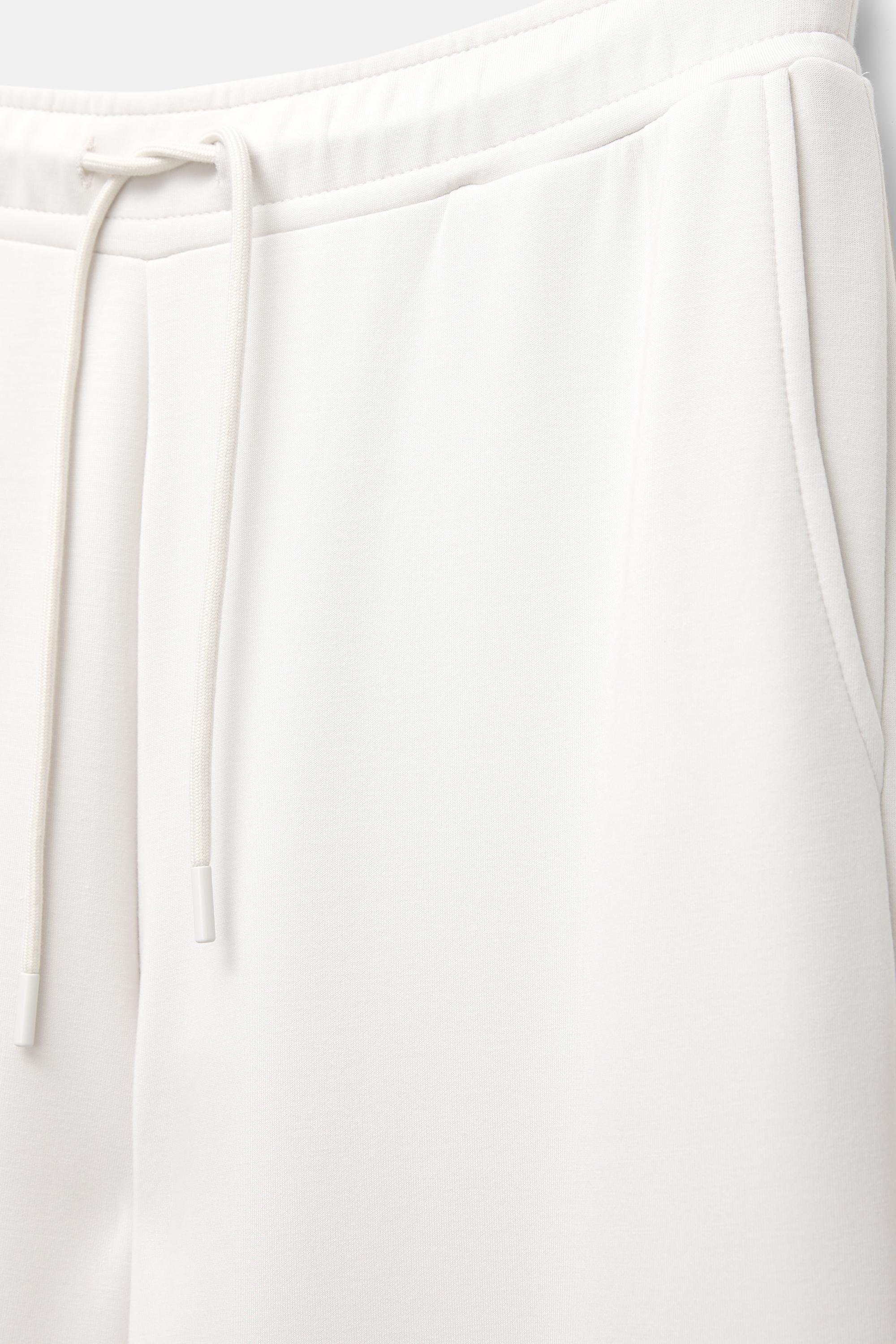 Soft-touch wide-leg trousers — Ecru