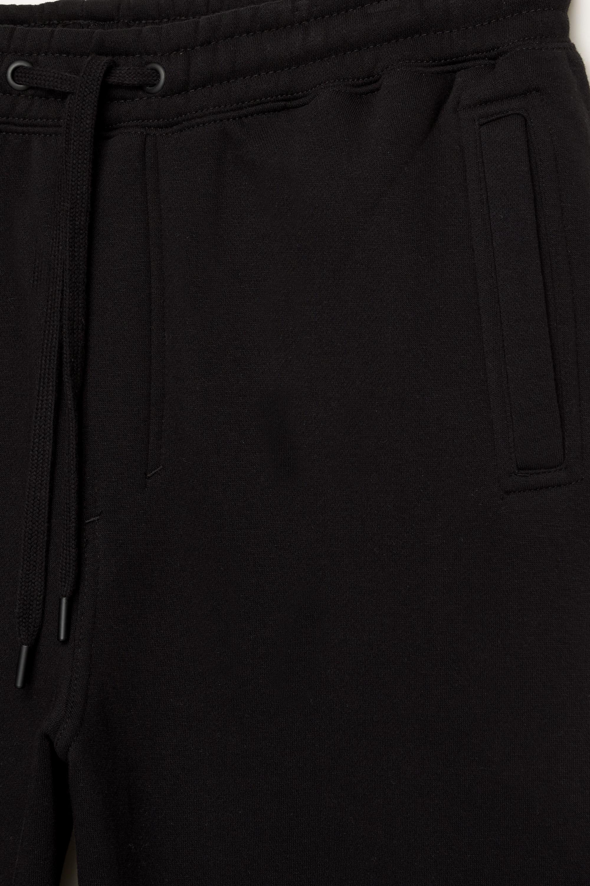 Basic baggy tracksuit bottoms — Black