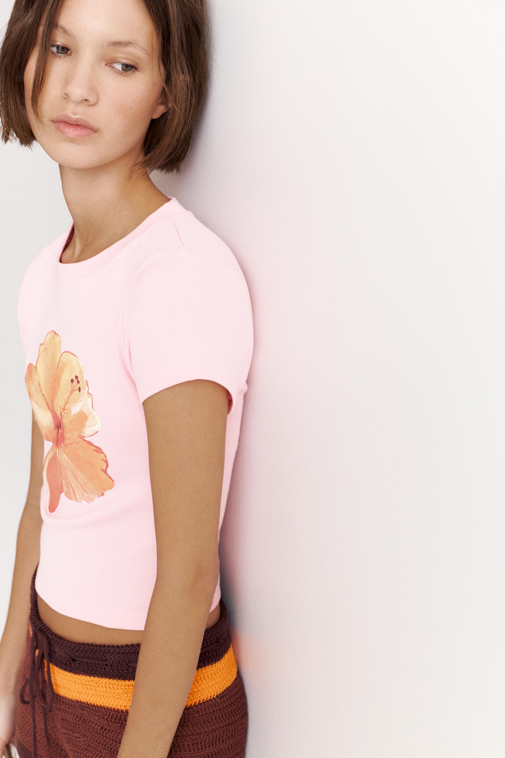 Pink hibiscus flower graphic T-shirt — Pale pink