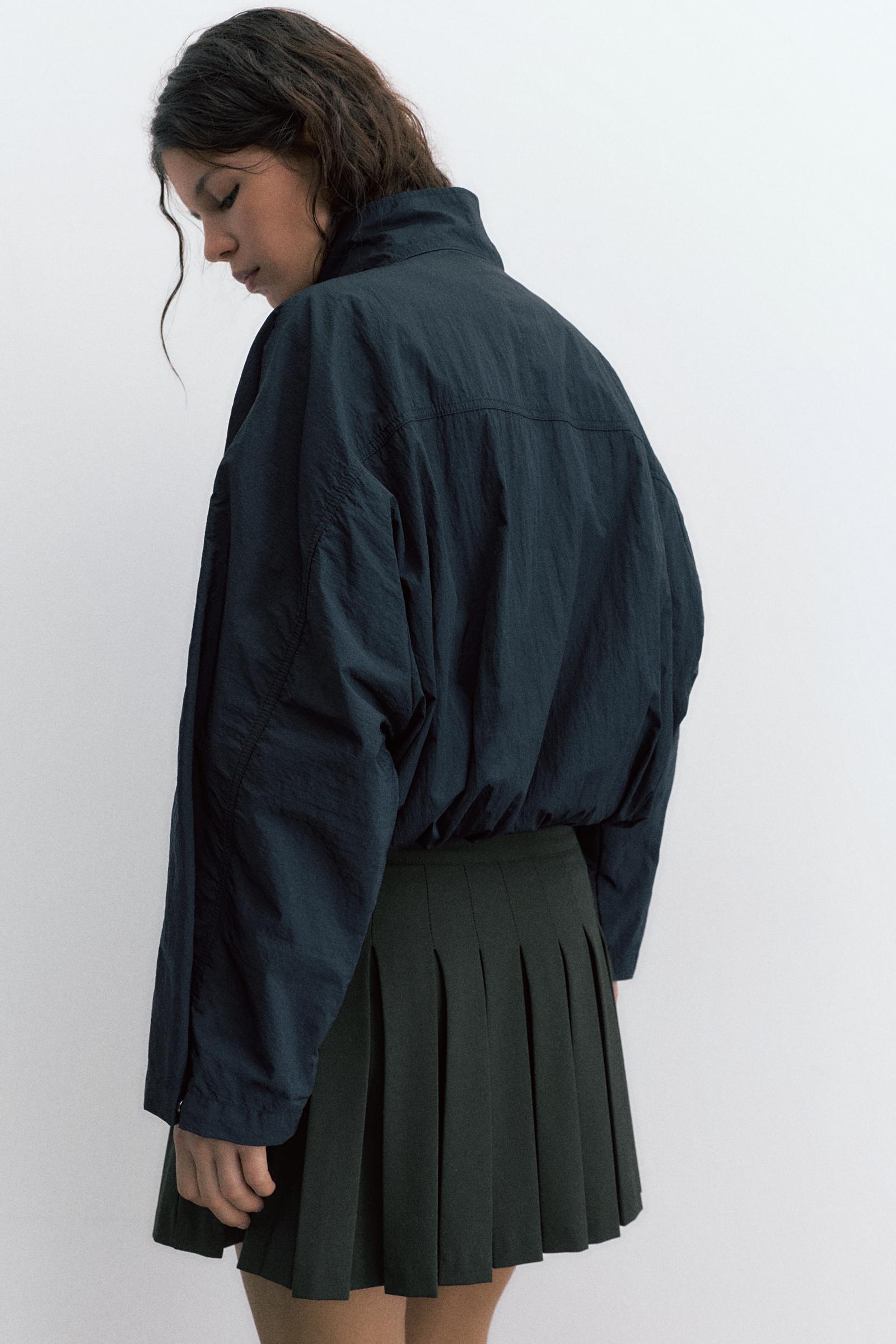 Pleated mini skirt — Black
