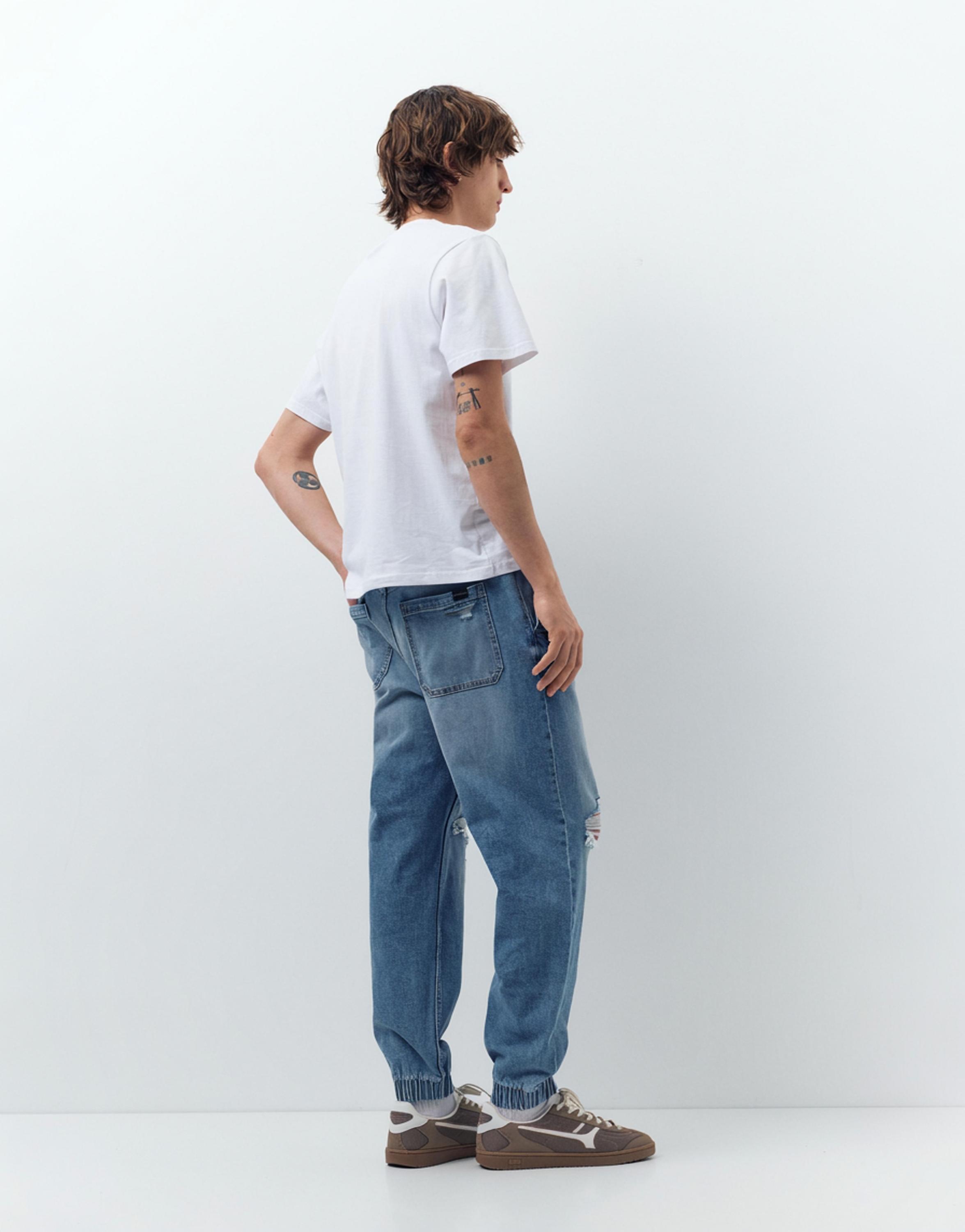 Ripped denim jogger trousers — Pale indigo