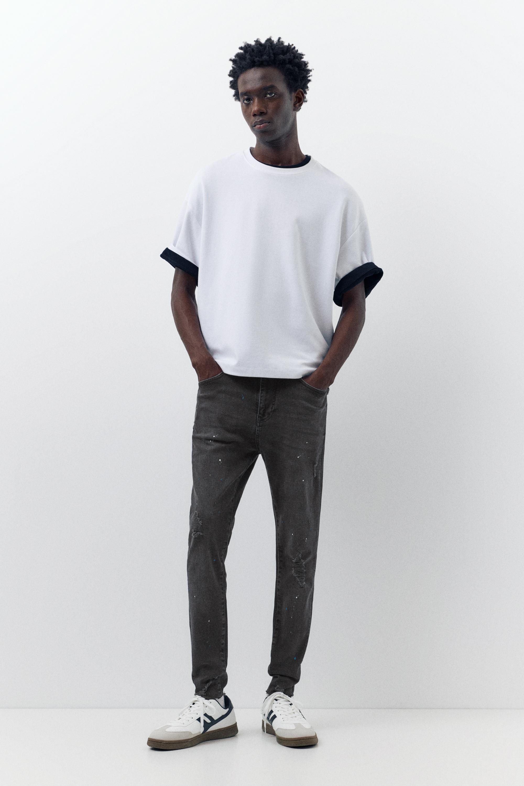 Paint splatter carrot-fit jeans — Faded black