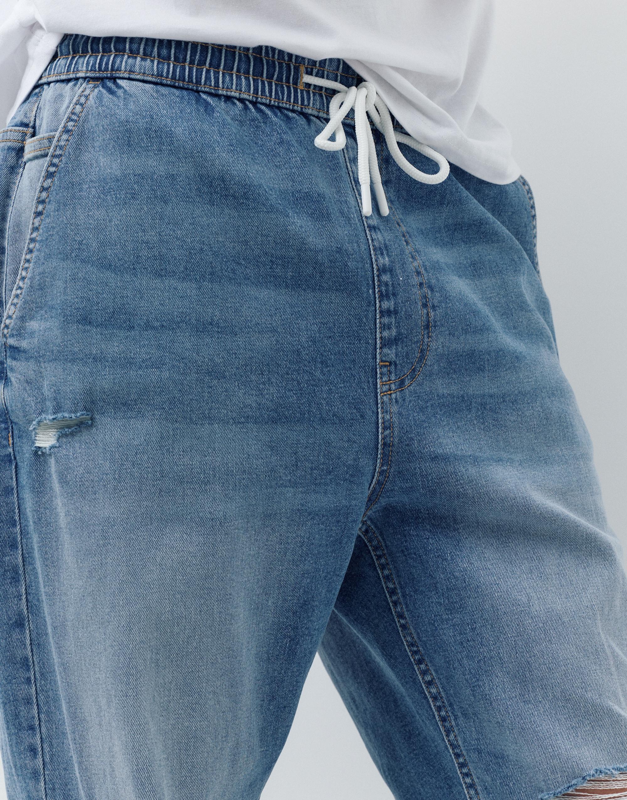 Ripped denim jogger trousers — Pale indigo