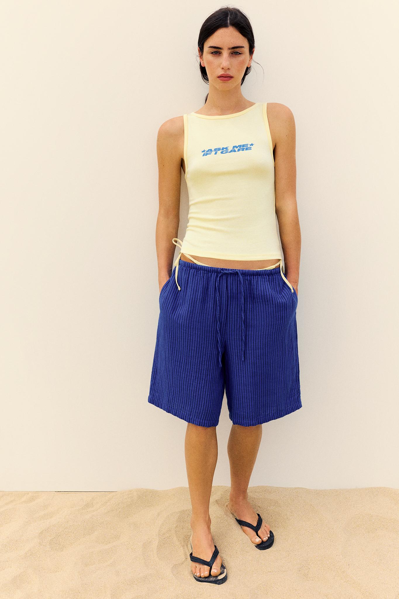 Yellow slogan tank top — Pale yellow