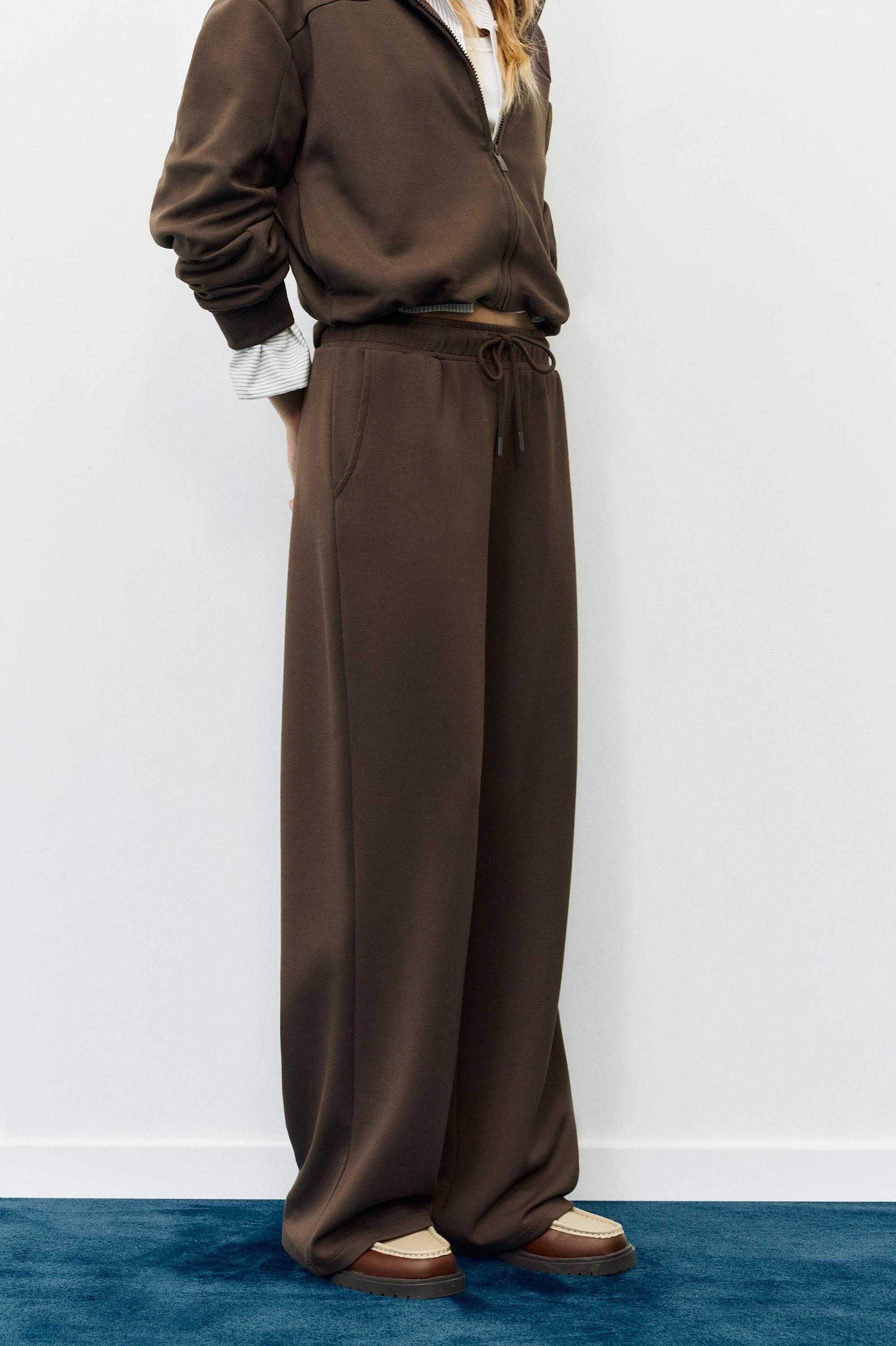 Soft-touch wide-leg trousers — Brown