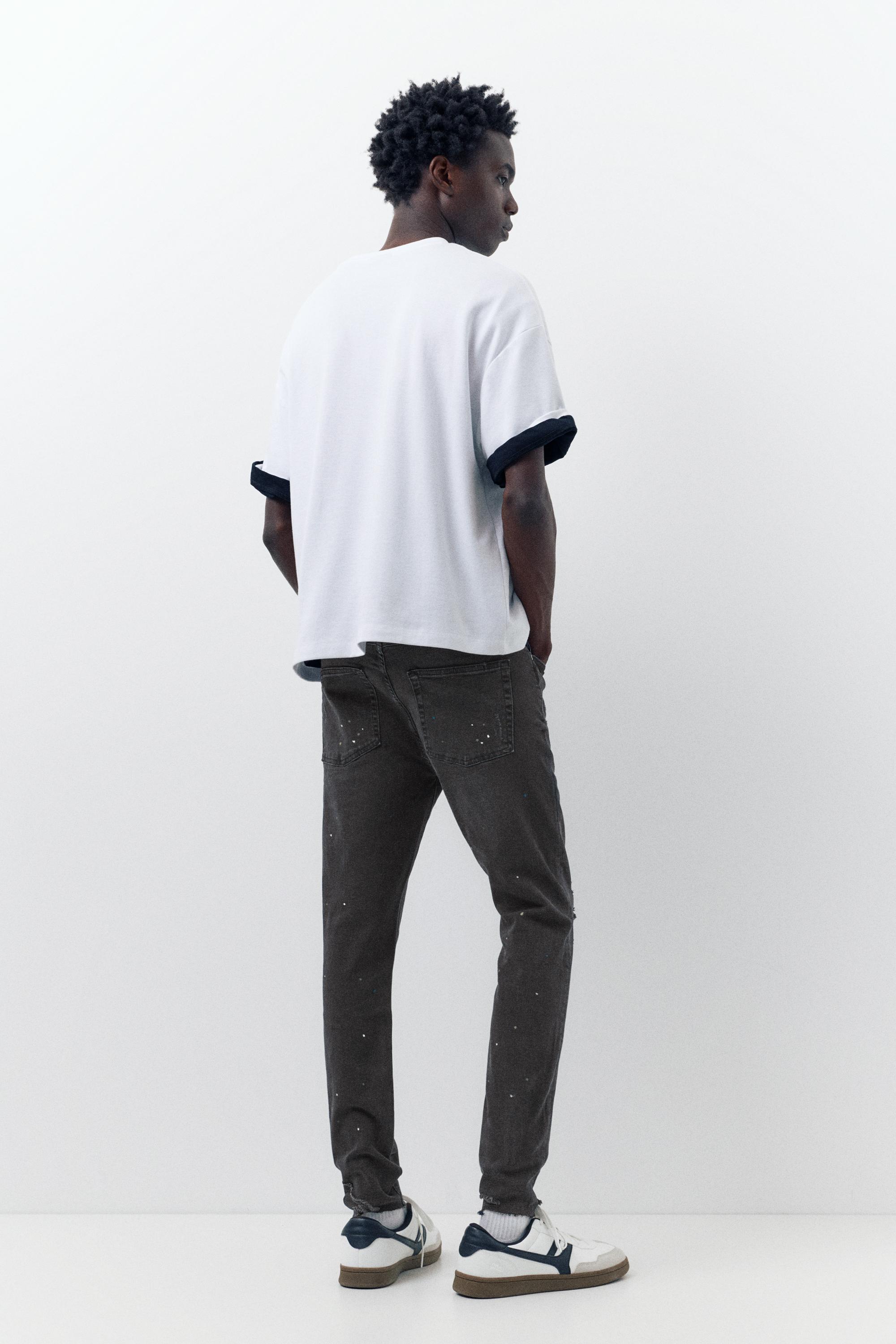 Paint splatter carrot-fit jeans — Faded black