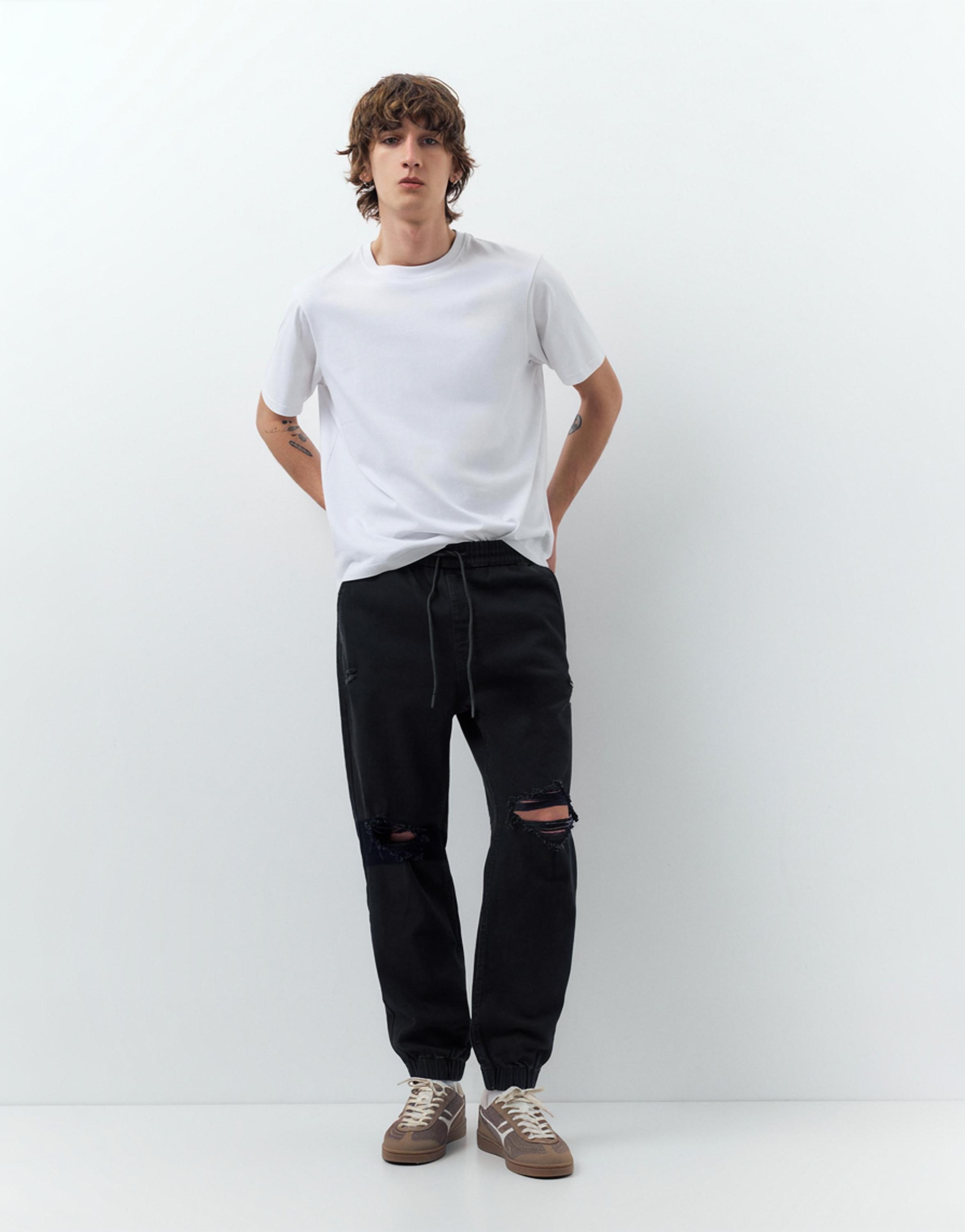 Ripped denim jogger trousers — Black