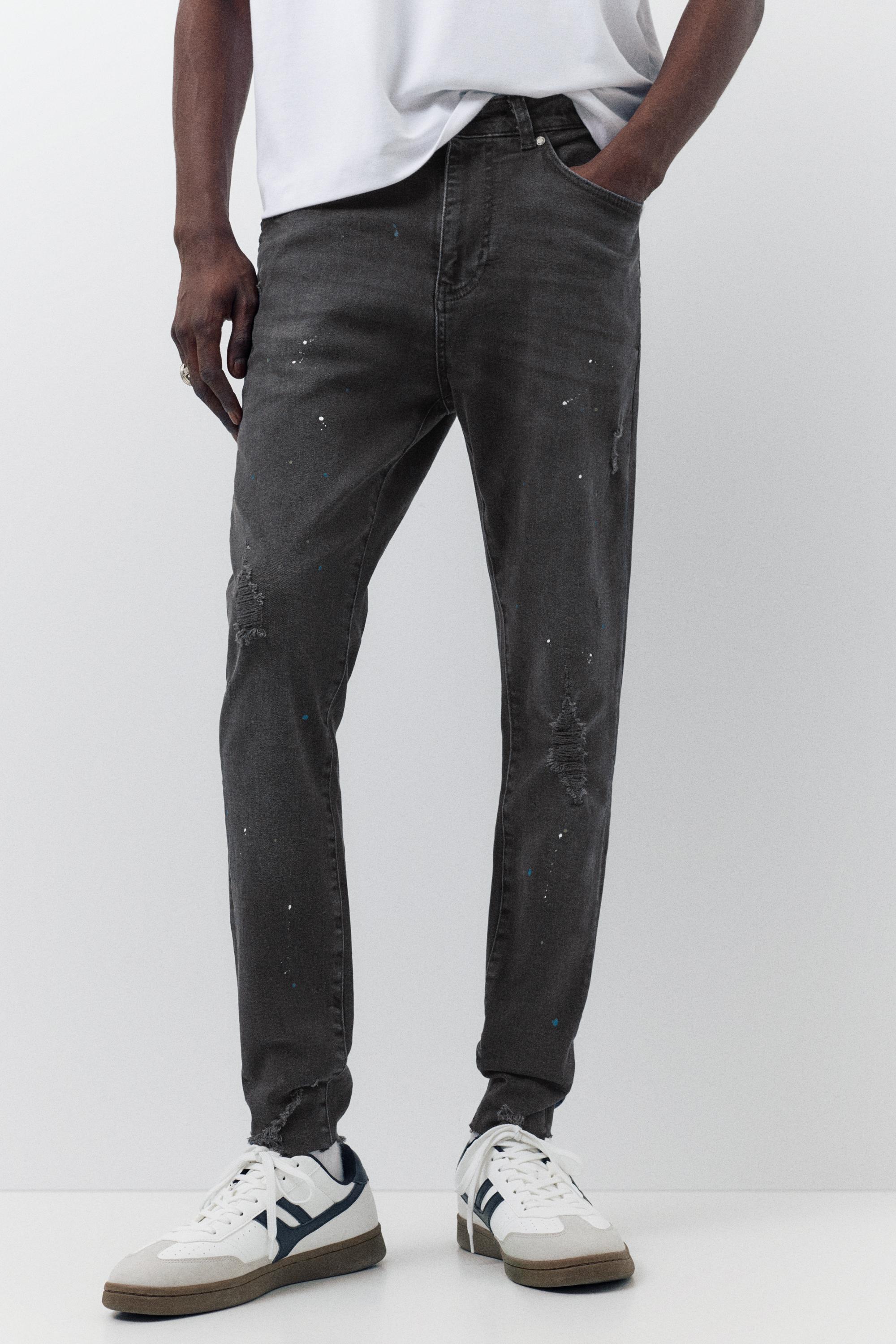 Paint splatter carrot-fit jeans — Faded black
