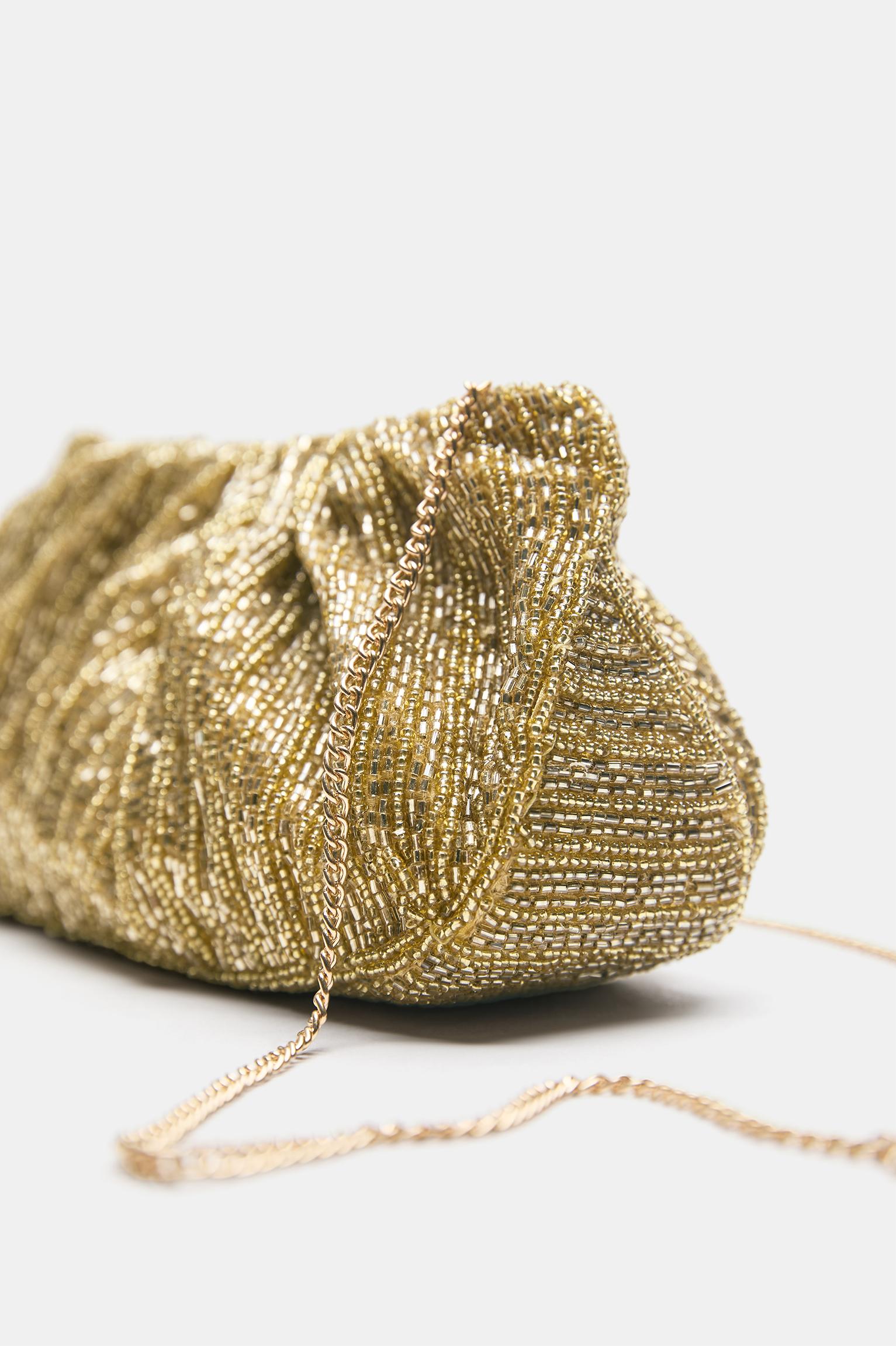 Altın rengi clutch çanta