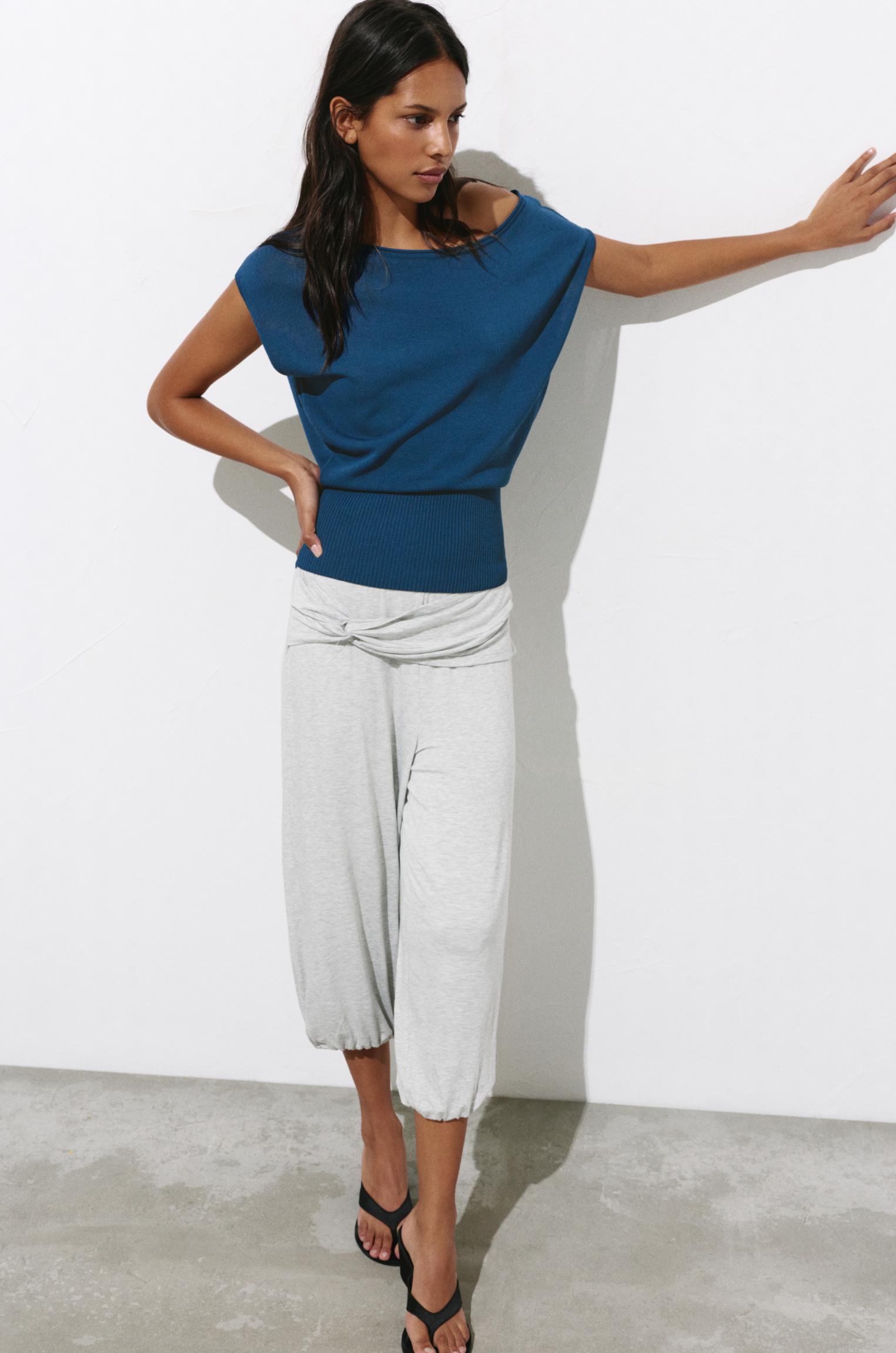 Short sleeve asymmetric knit top — Indigo
