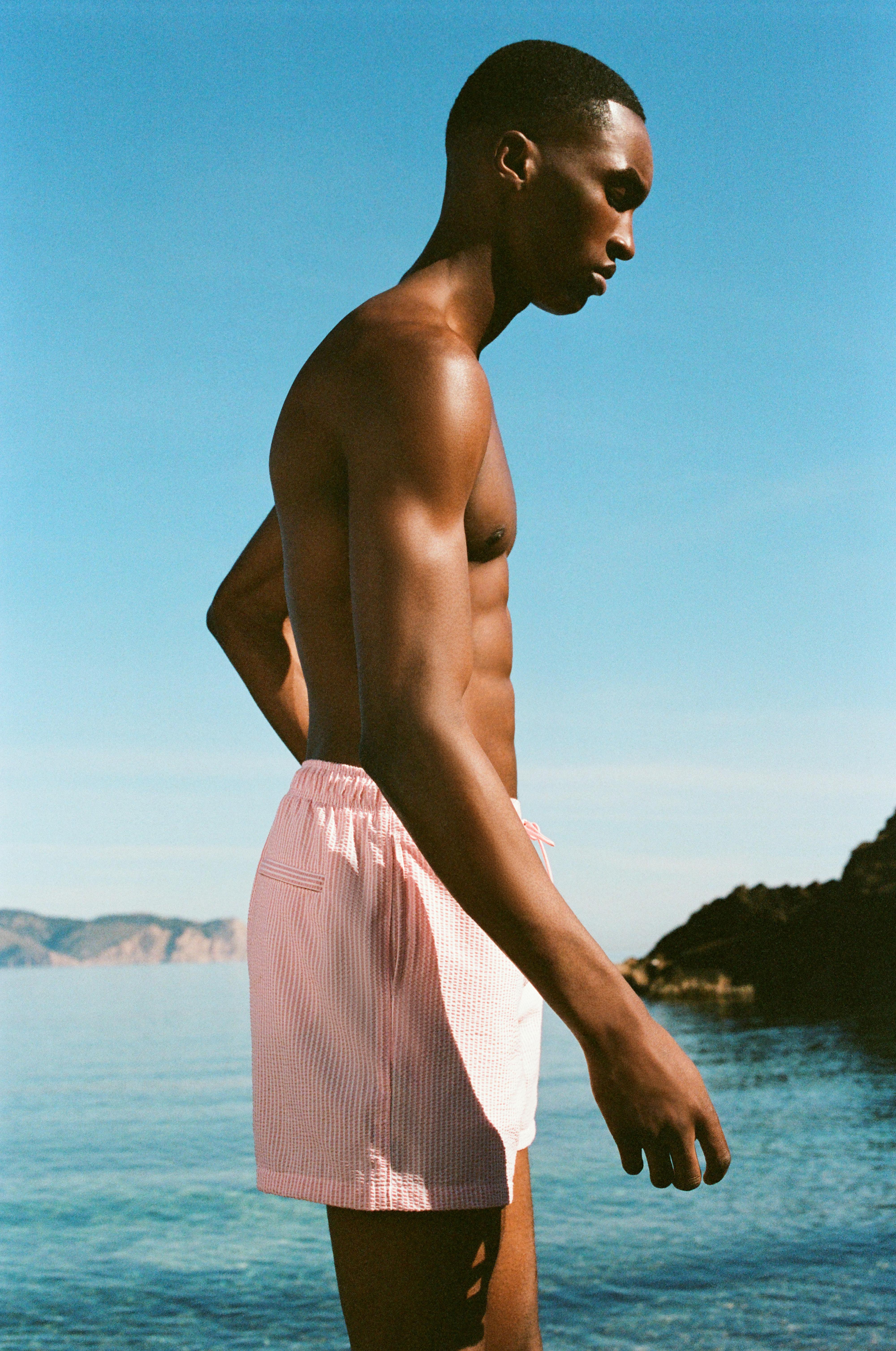 Striped seersucker swimming trunks — Pink