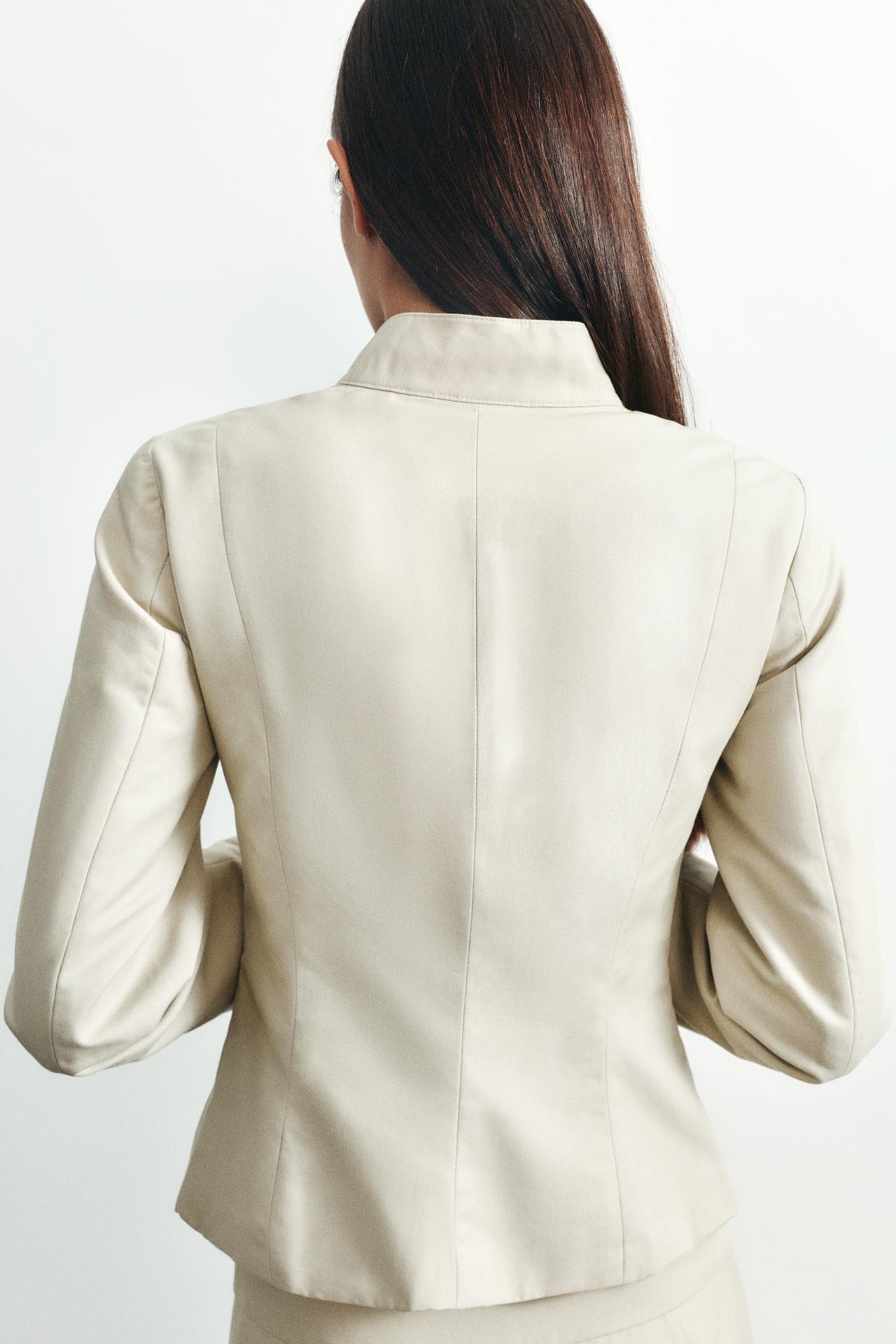 Fitted high neck jacket — Sand