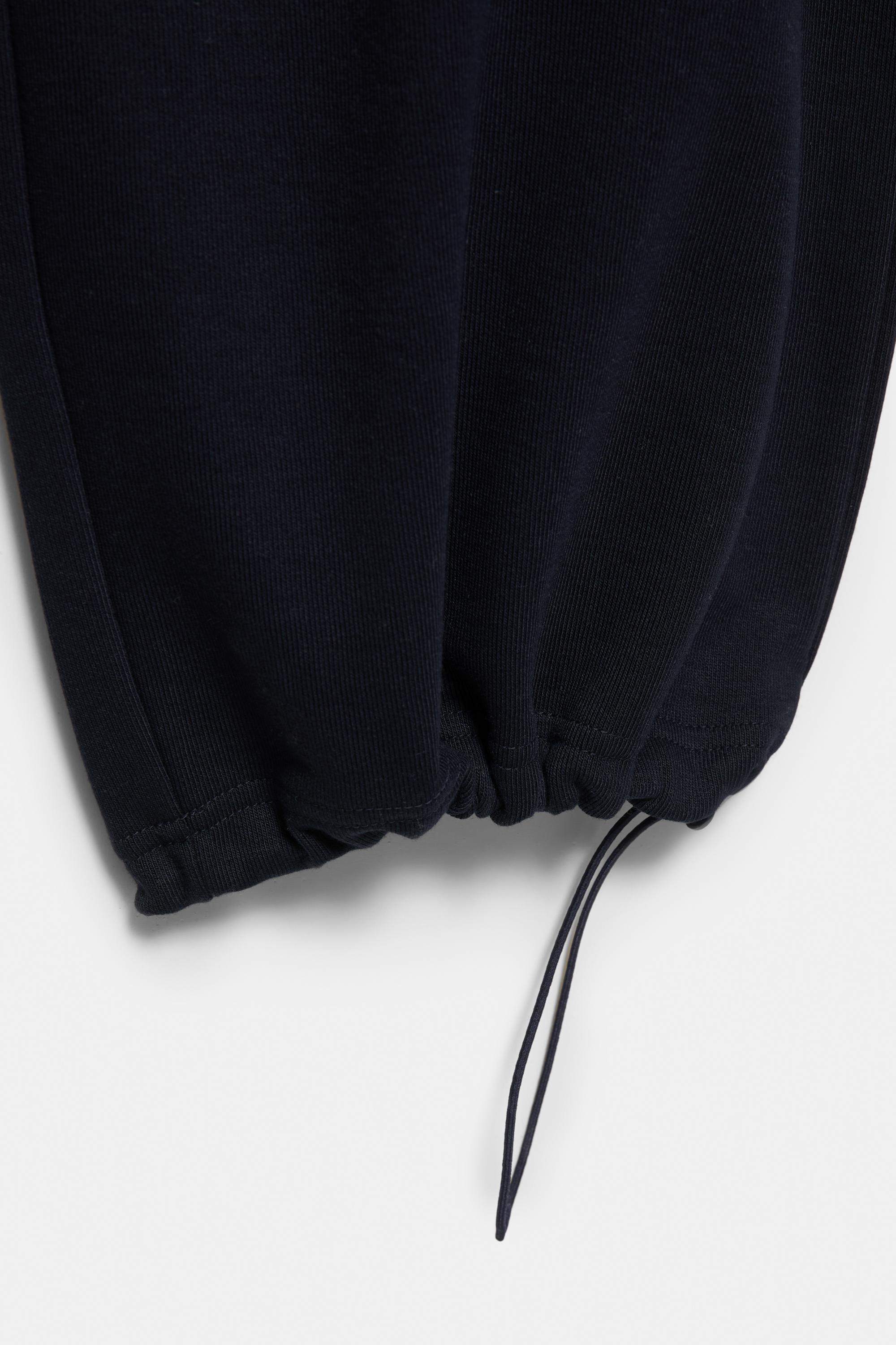 Wide-leg tracksuit bottoms with adjustable hem — Navy