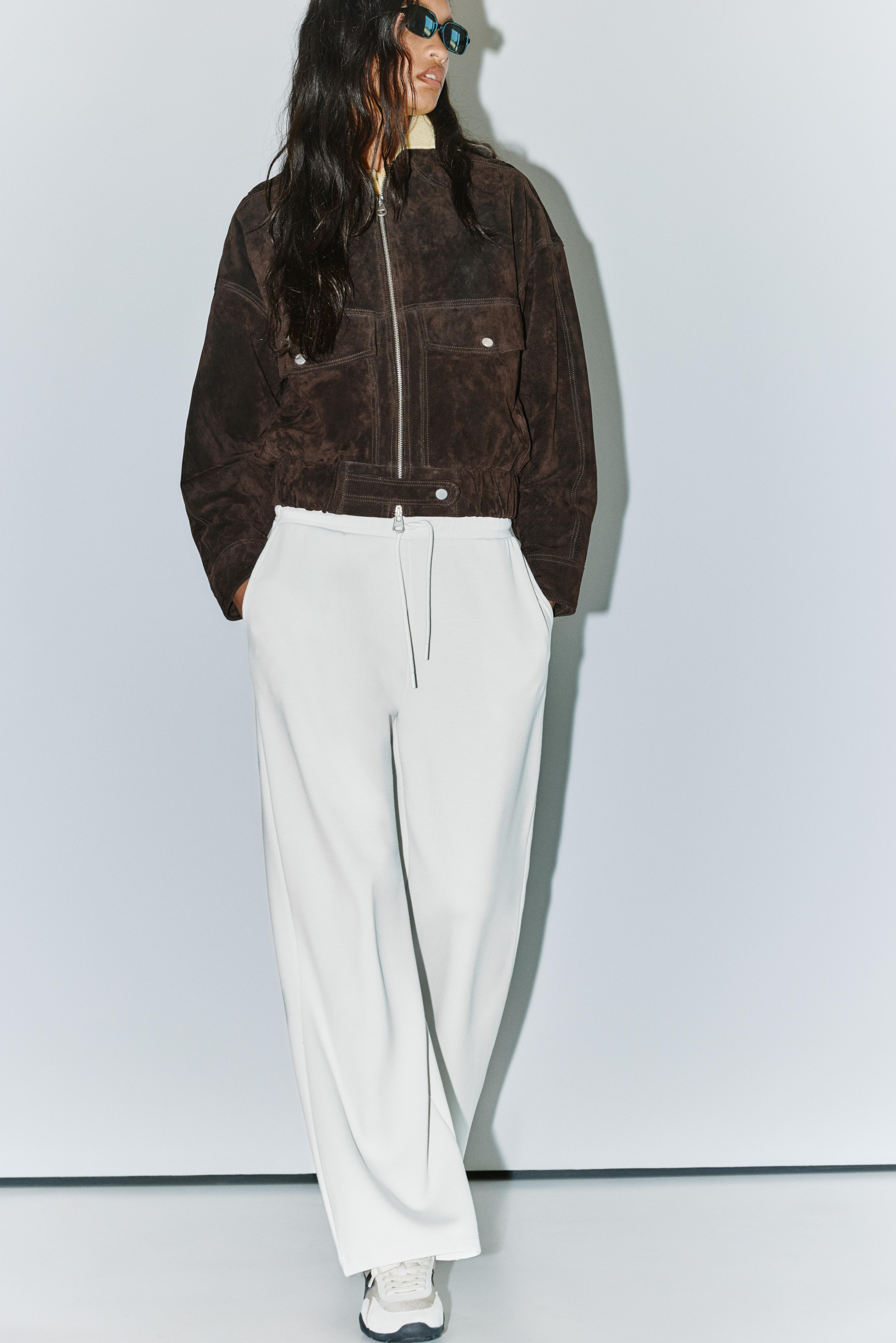 Soft-touch wide-leg trousers — Ecru