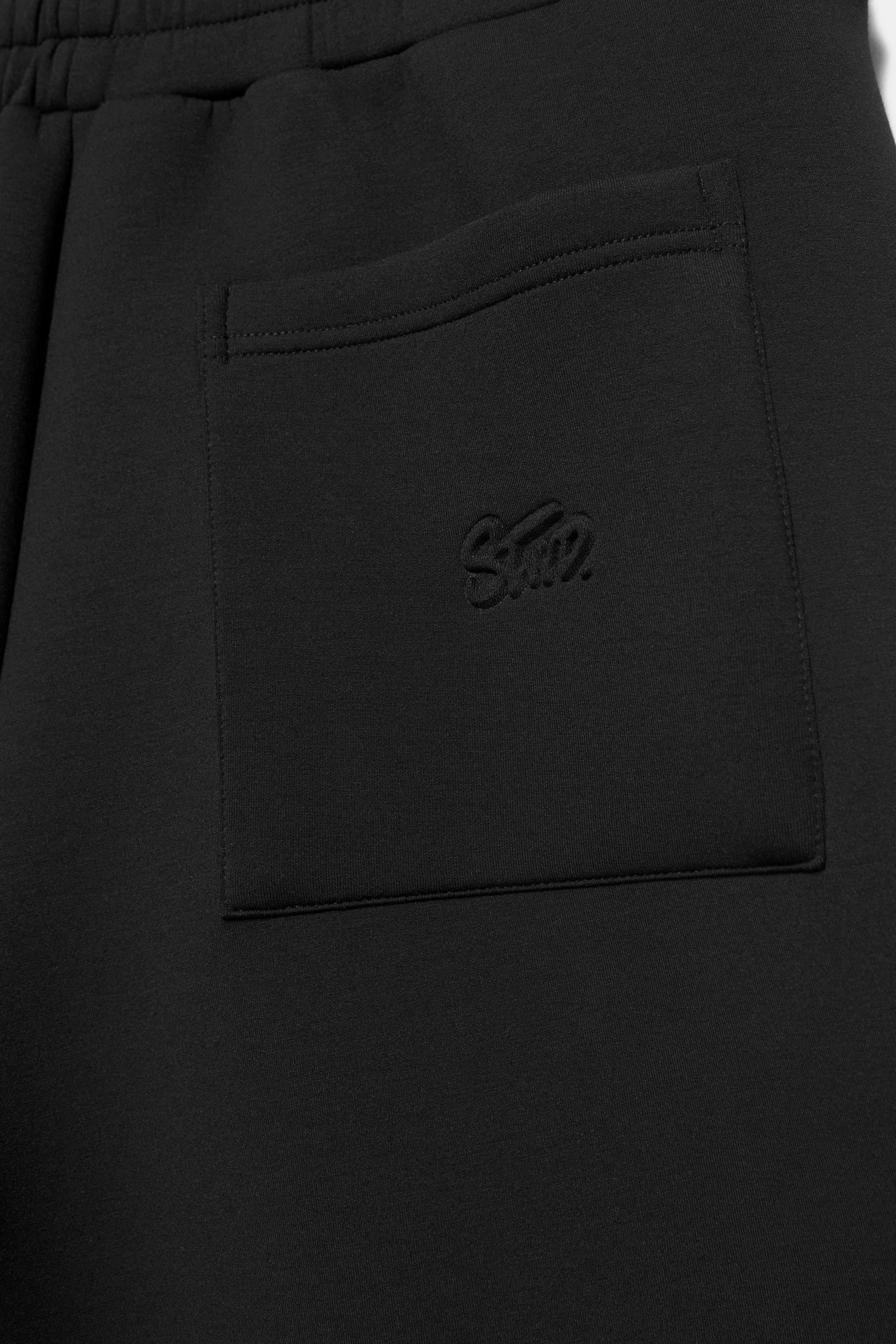 Neoprene-effect jogger Bermuda shorts — Black