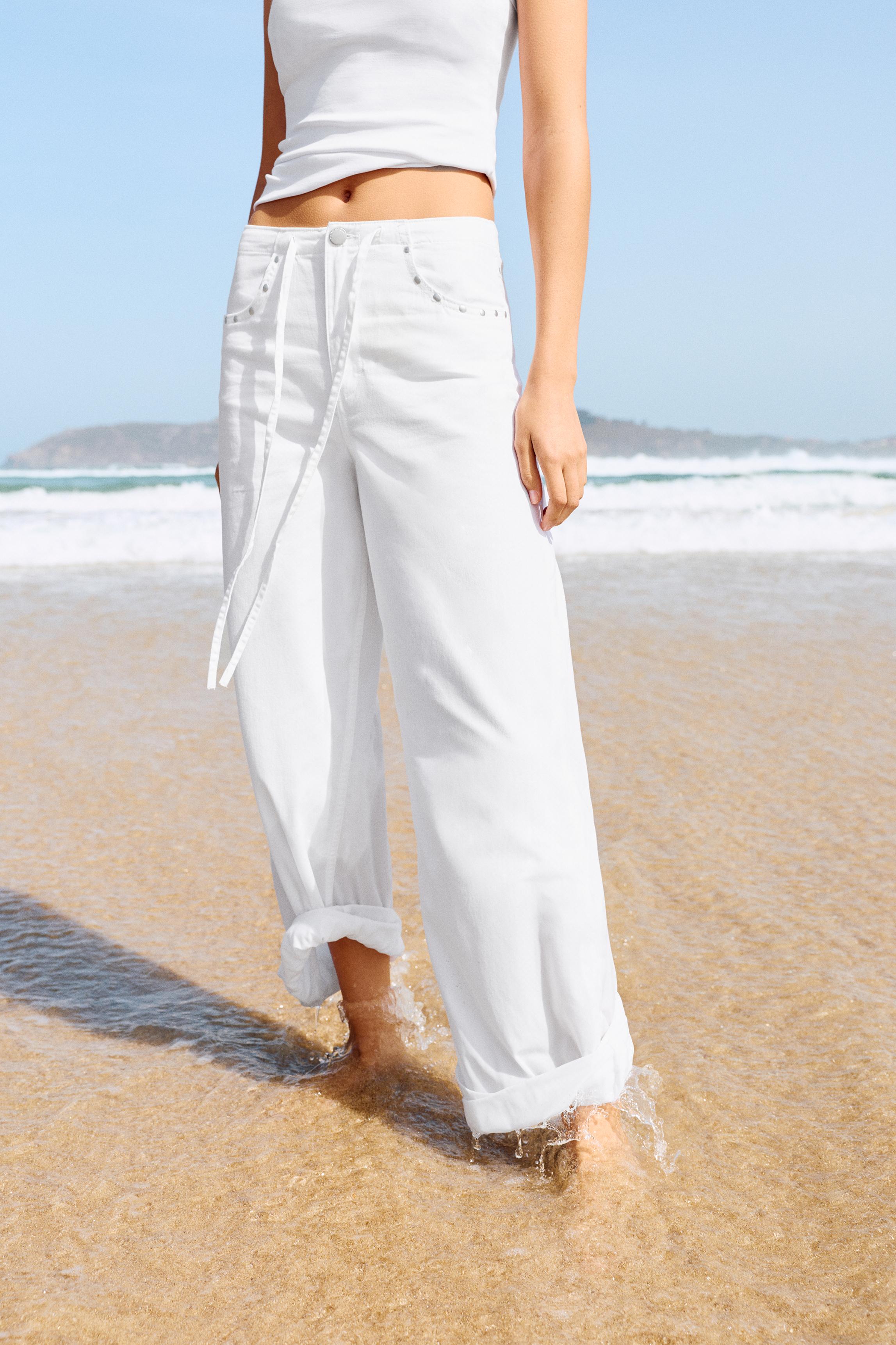 White studded baggy jeans — White