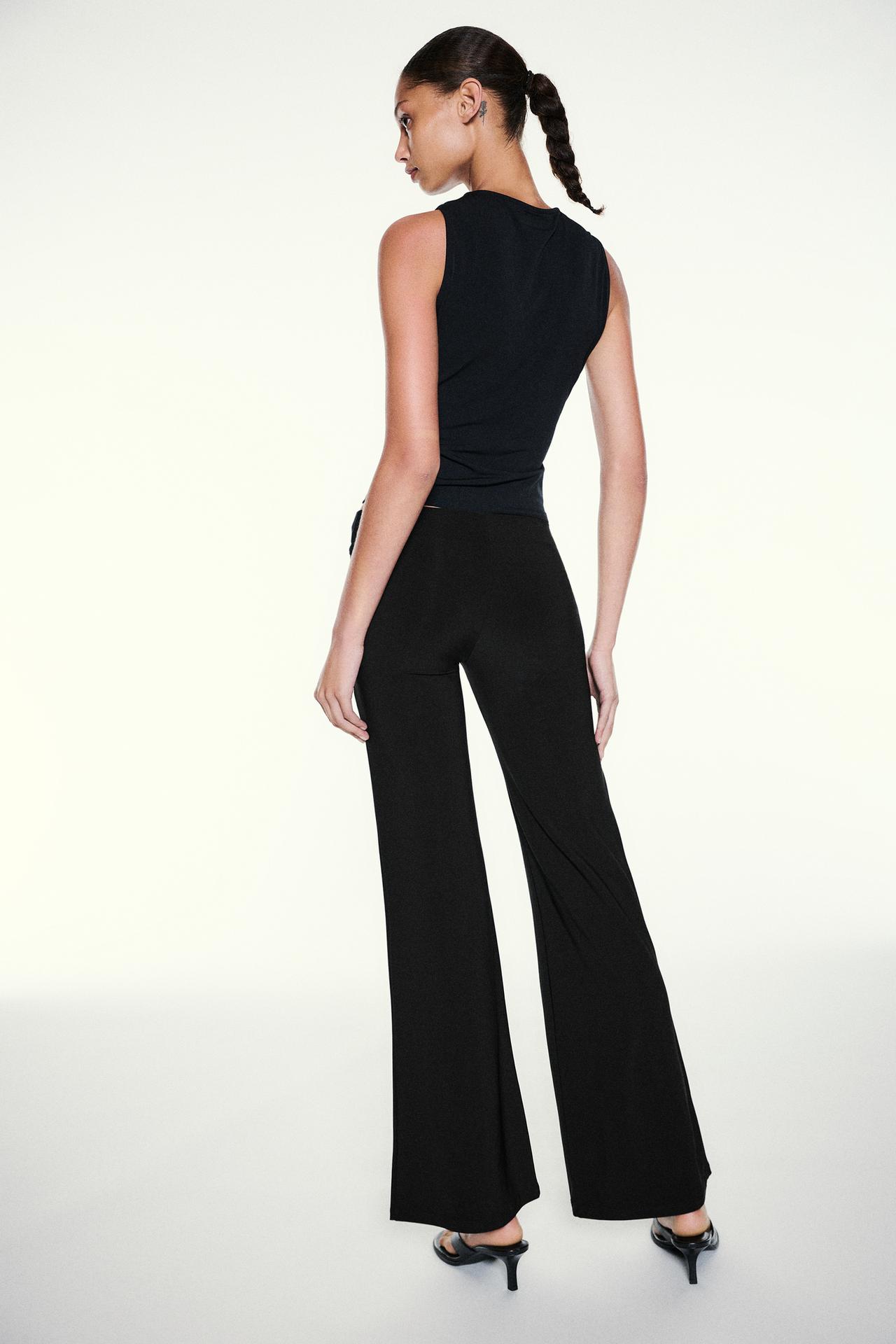 Black flared trousers — Black