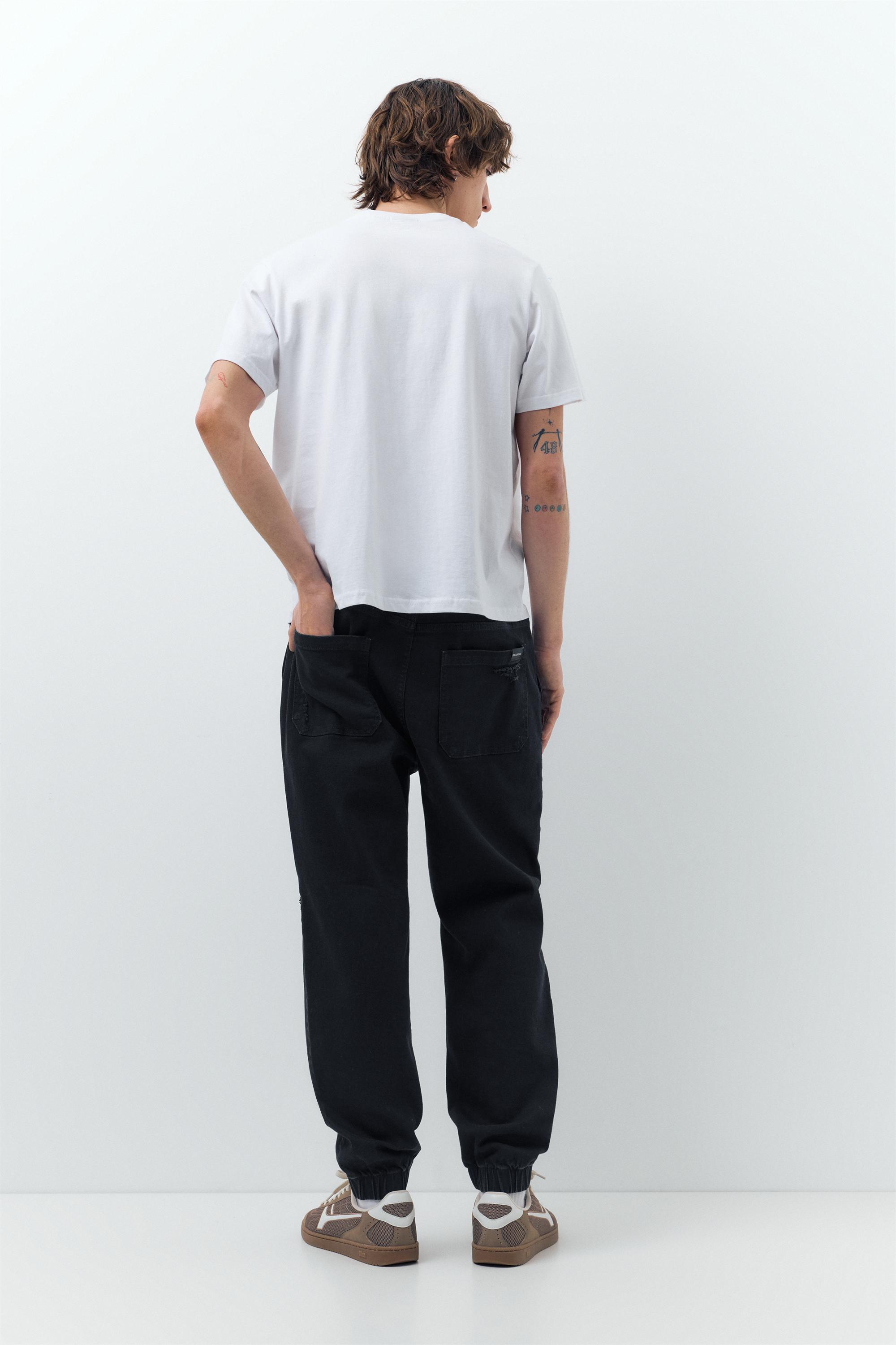 Ripped denim jogger trousers — Black