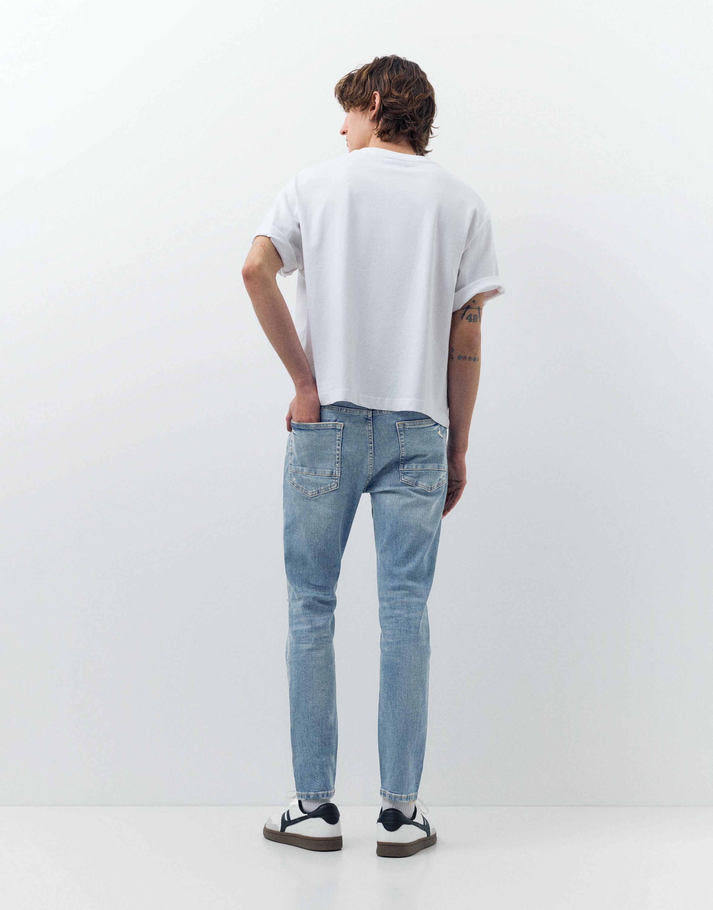 Ripped skinny jeans — Medium blue
