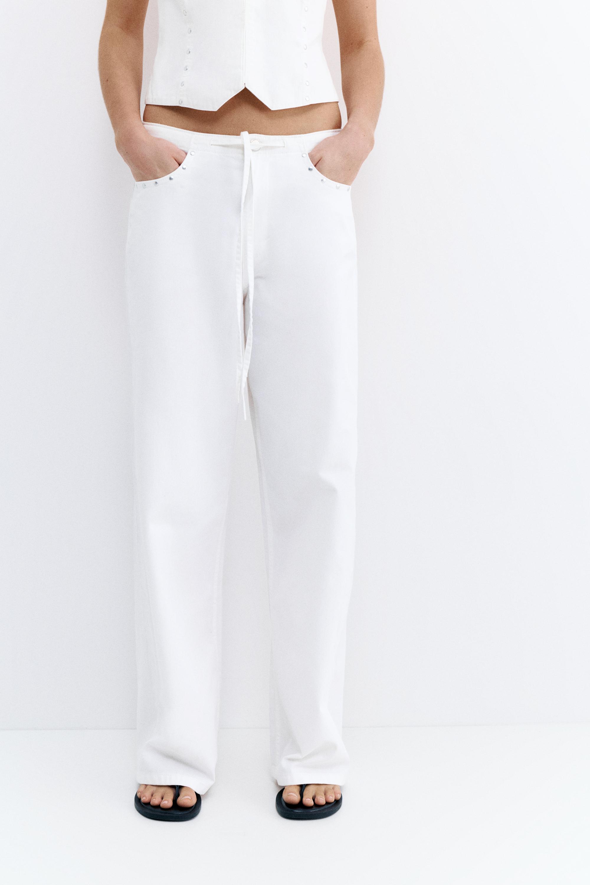 White studded baggy jeans — White