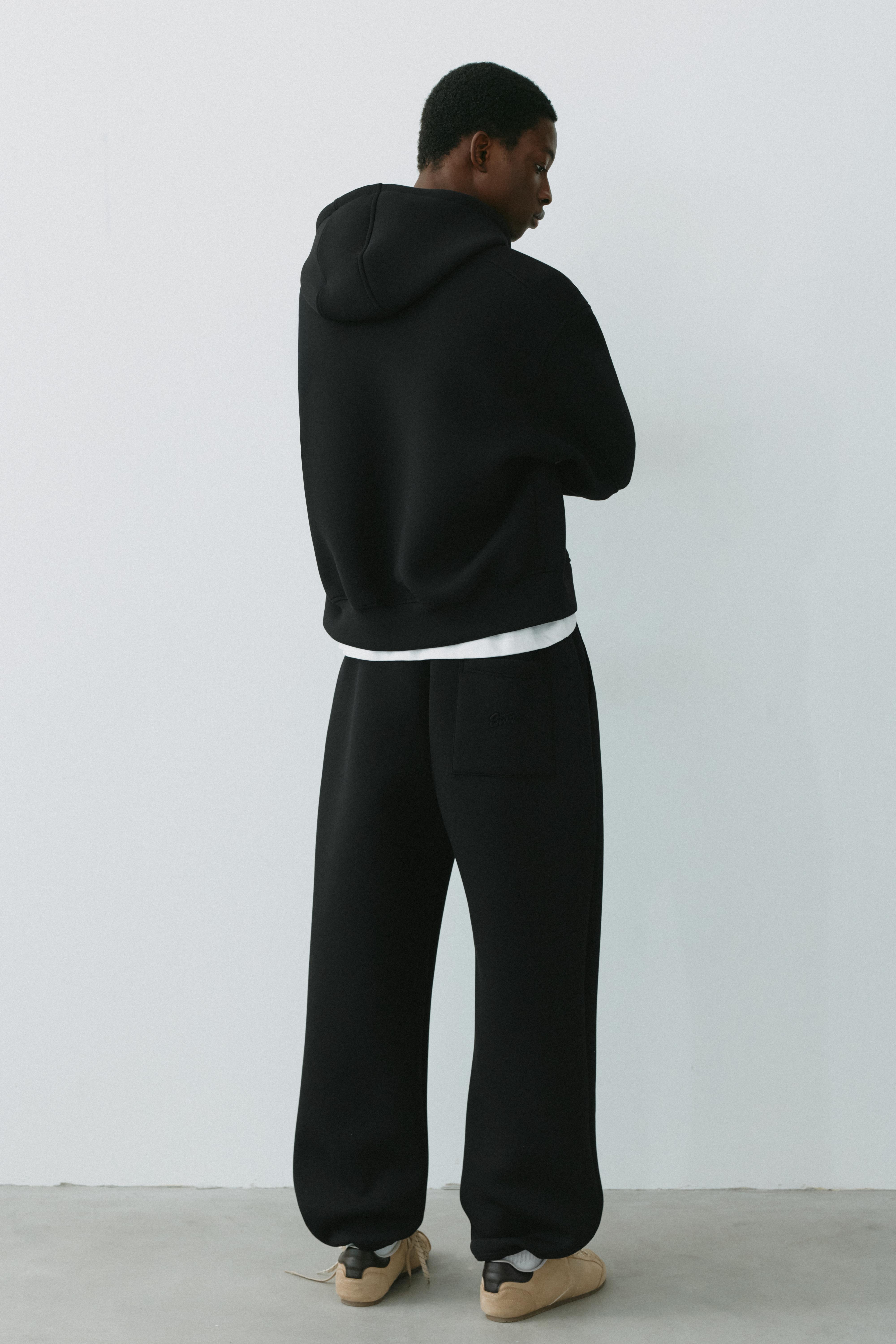 Neoprene-effect baggy trousers — Black