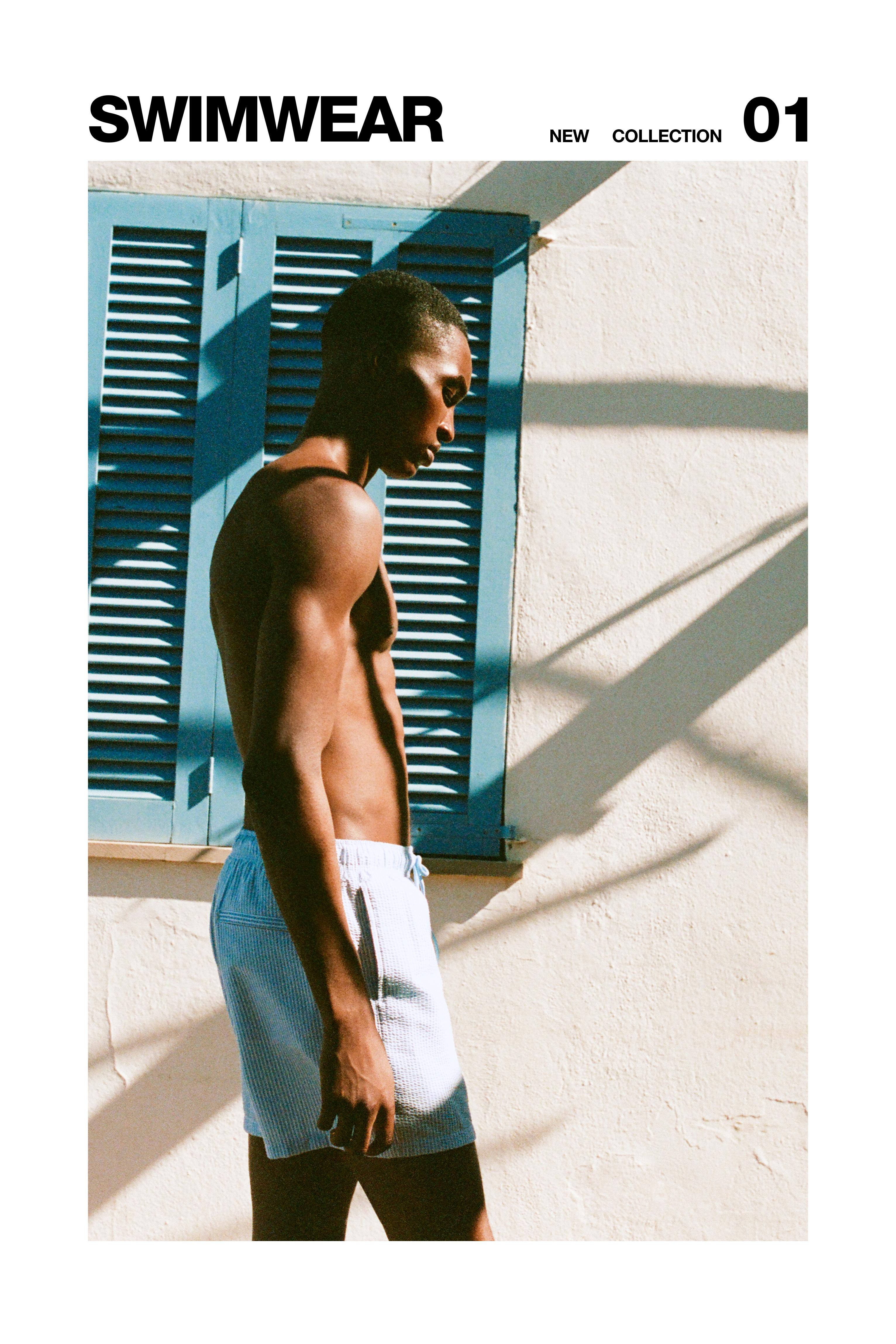 Striped seersucker swimming trunks — Blue