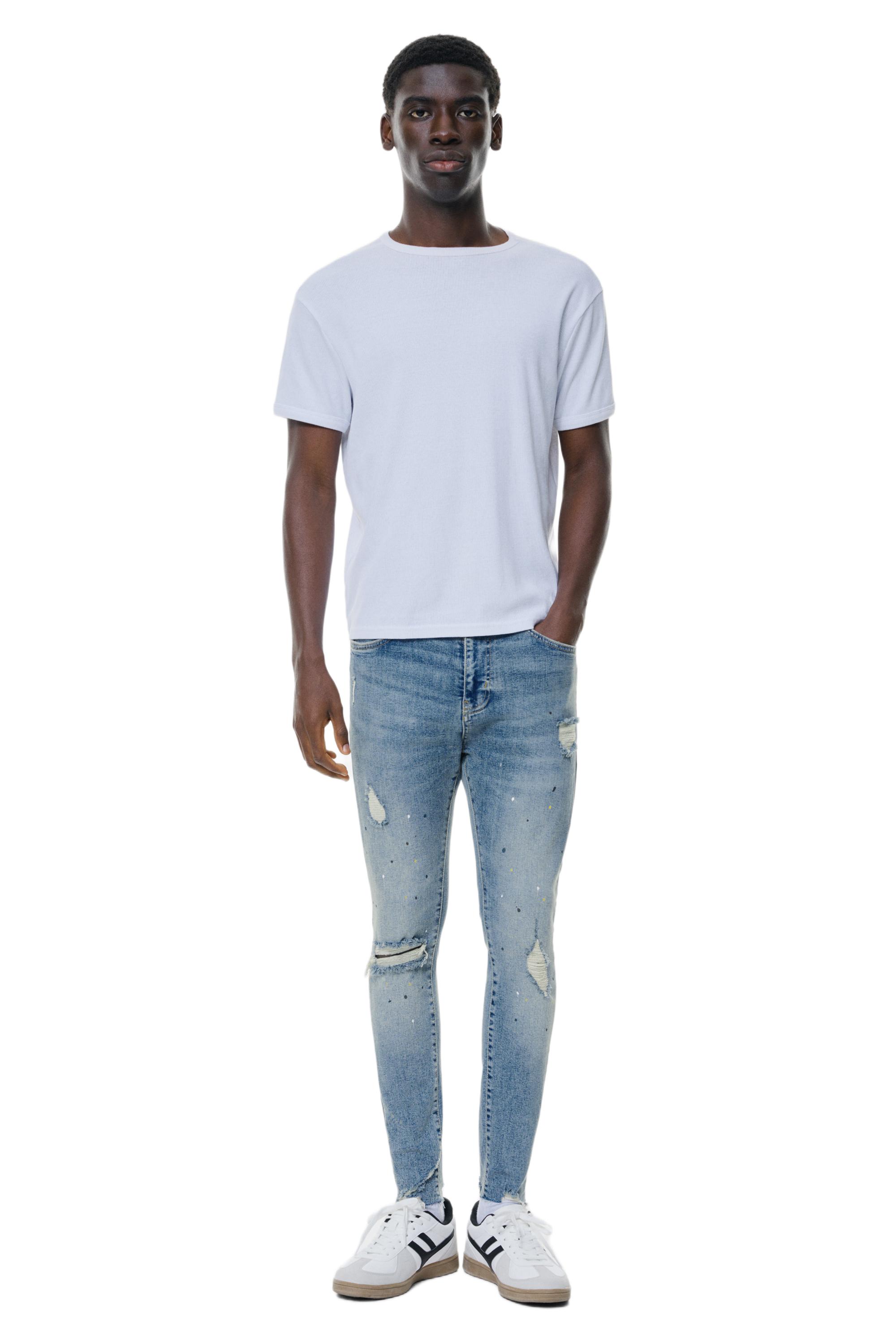 Paint splatter carrot-fit jeans — Medium blue