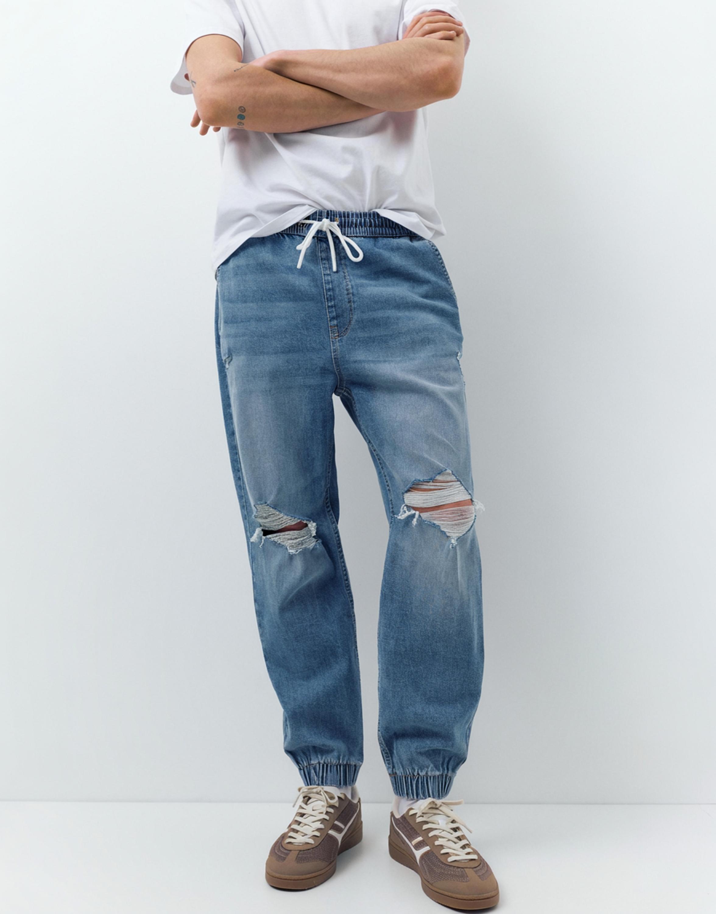 Ripped denim jogger trousers — Pale indigo