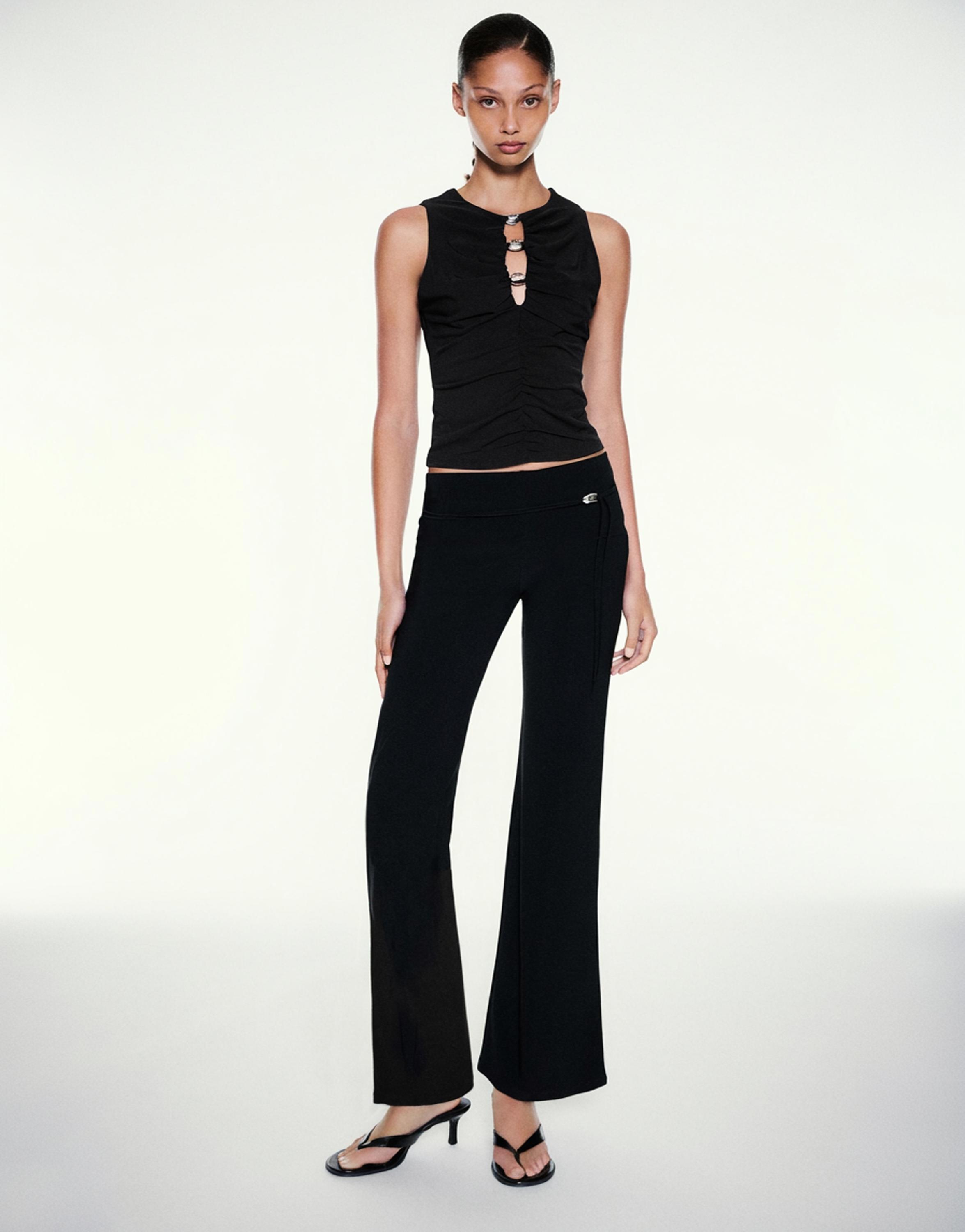 Cut-out embellished top — Black