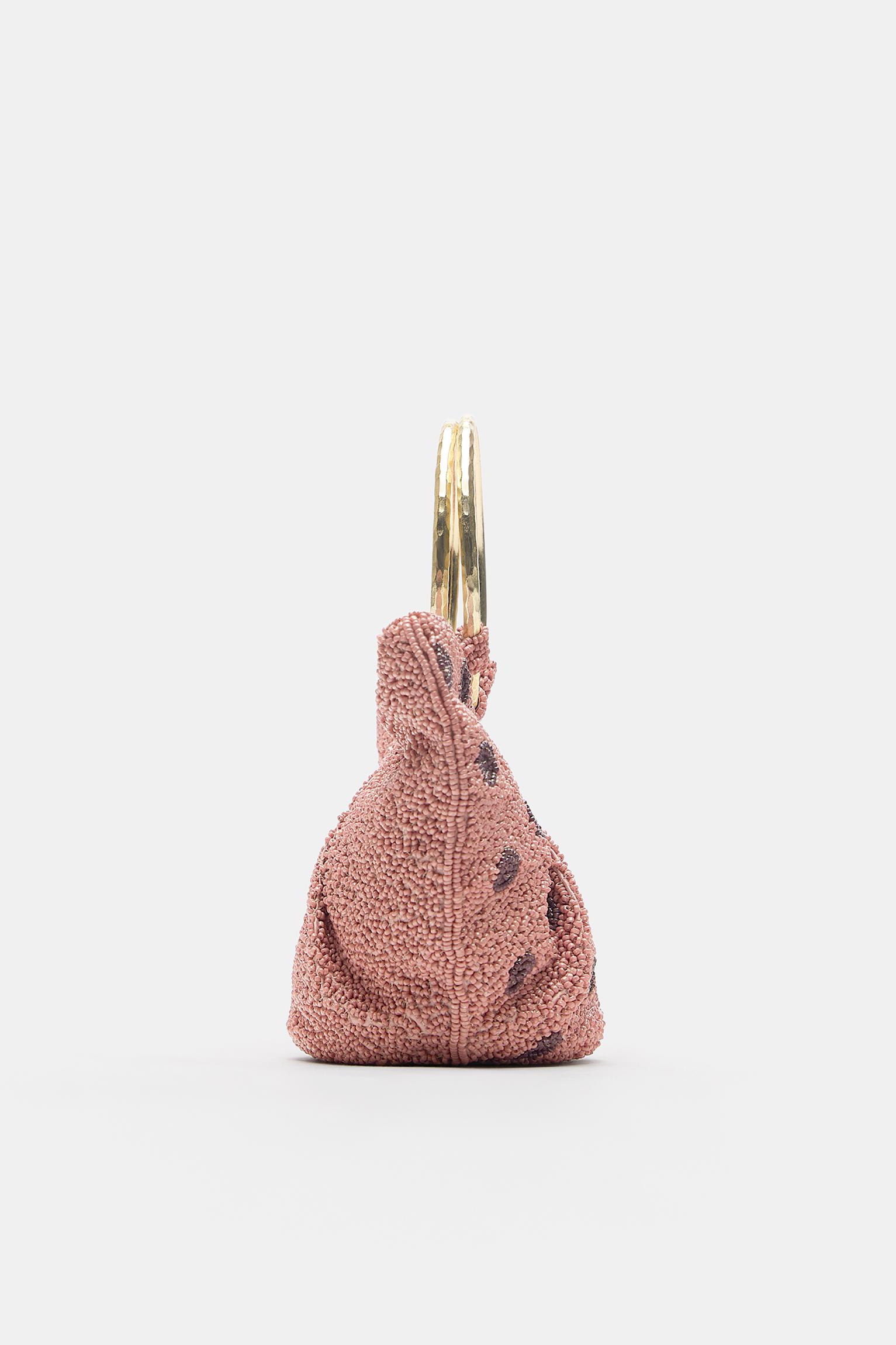 Puantiye desenli metal saplı çanta