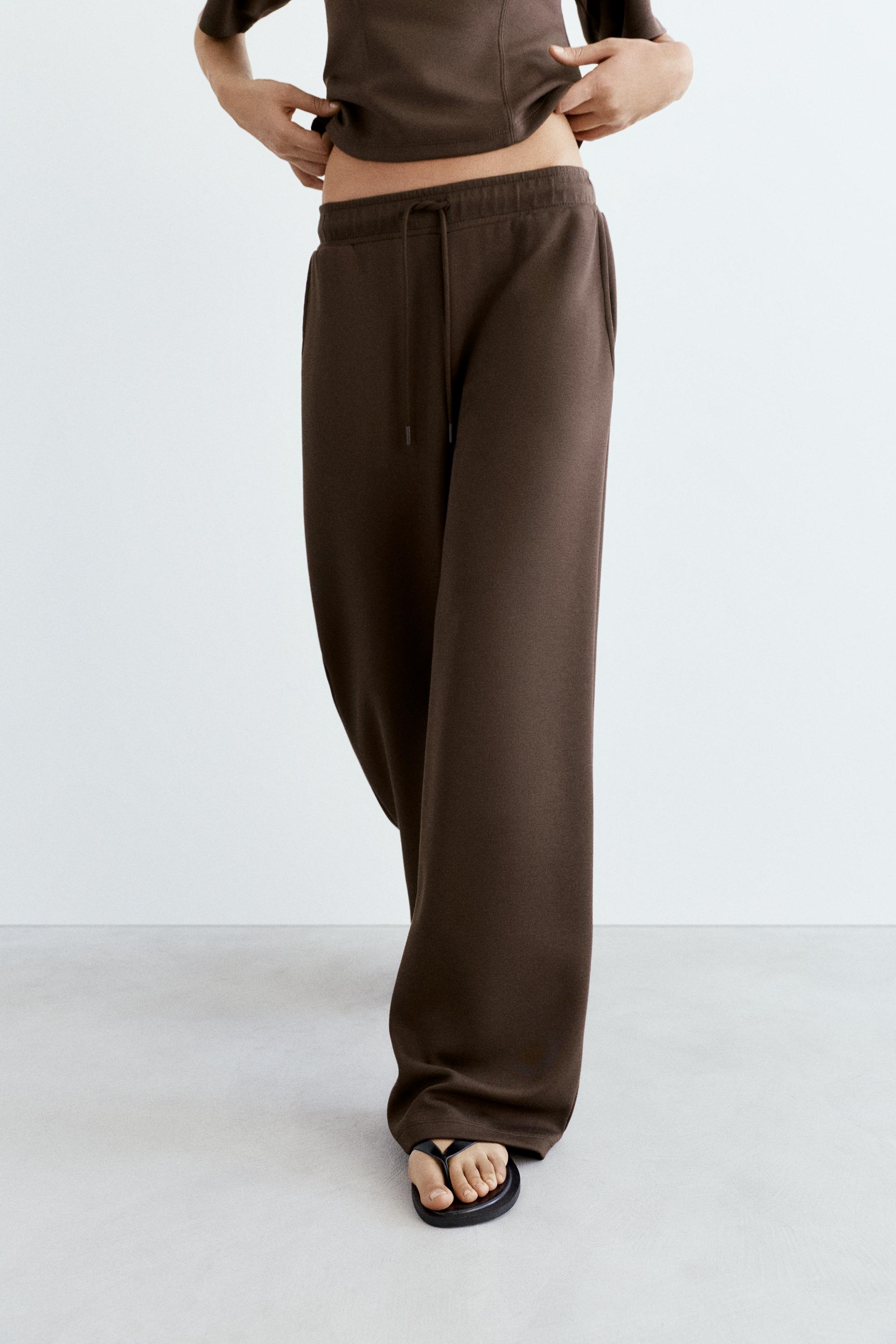 Soft-touch wide-leg trousers — Brown