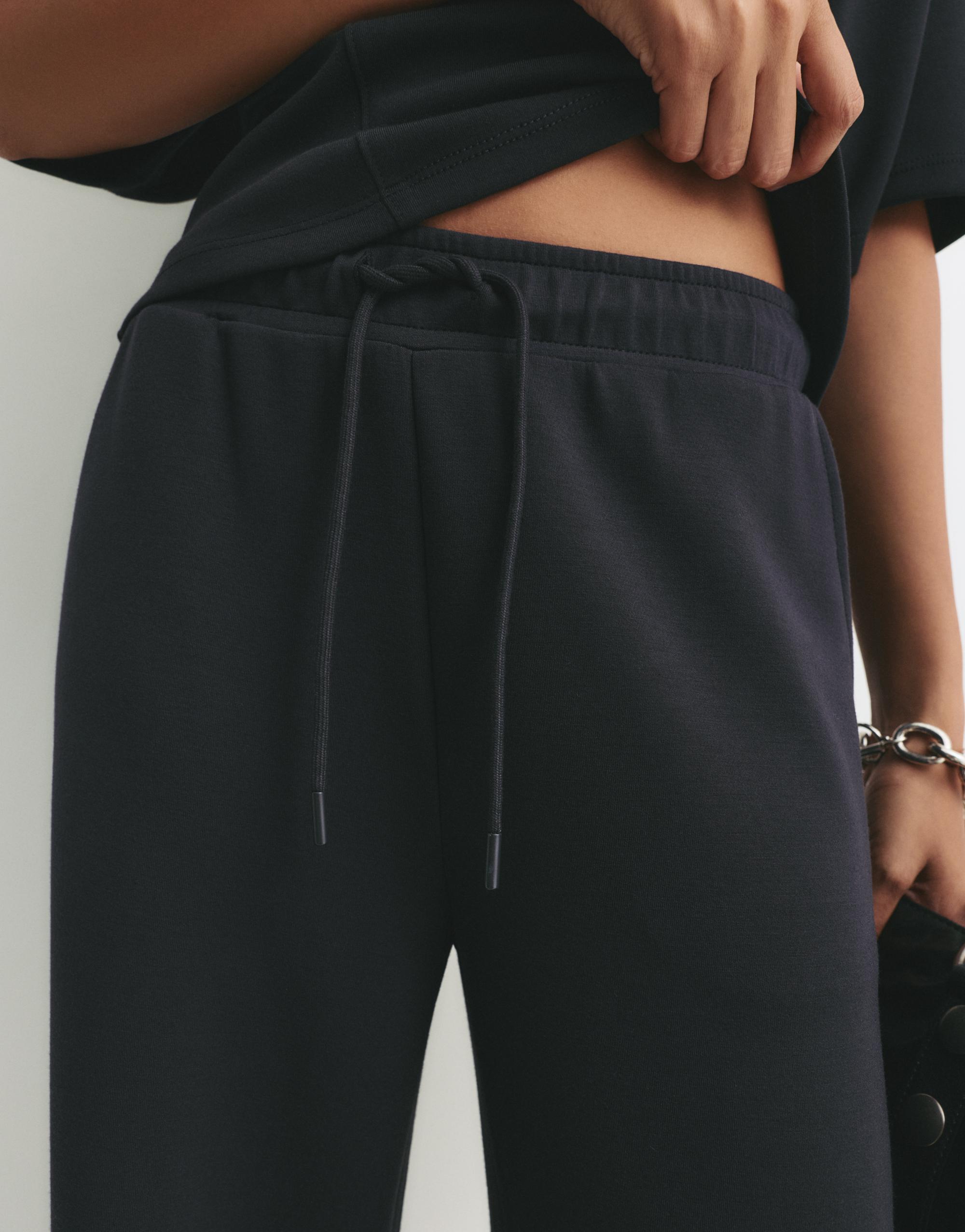 Soft-touch wide-leg trousers — Black