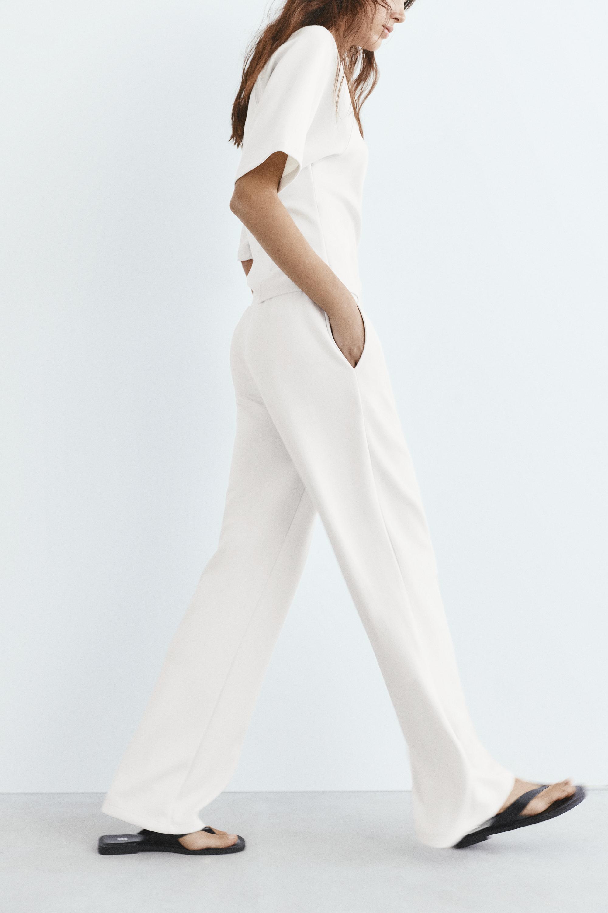 Soft-touch wide-leg trousers — Ecru