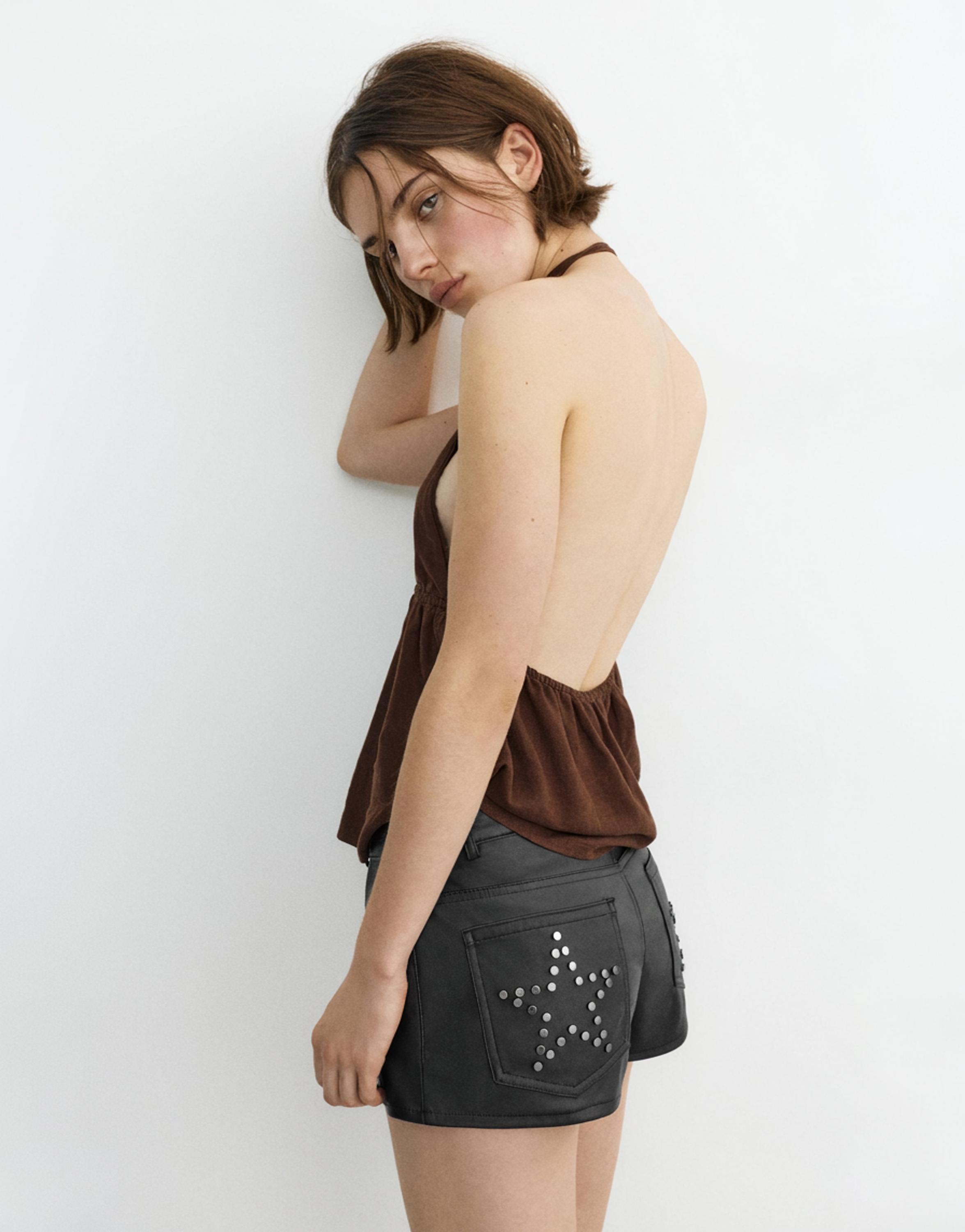 Studded faux leather mini shorts — Black