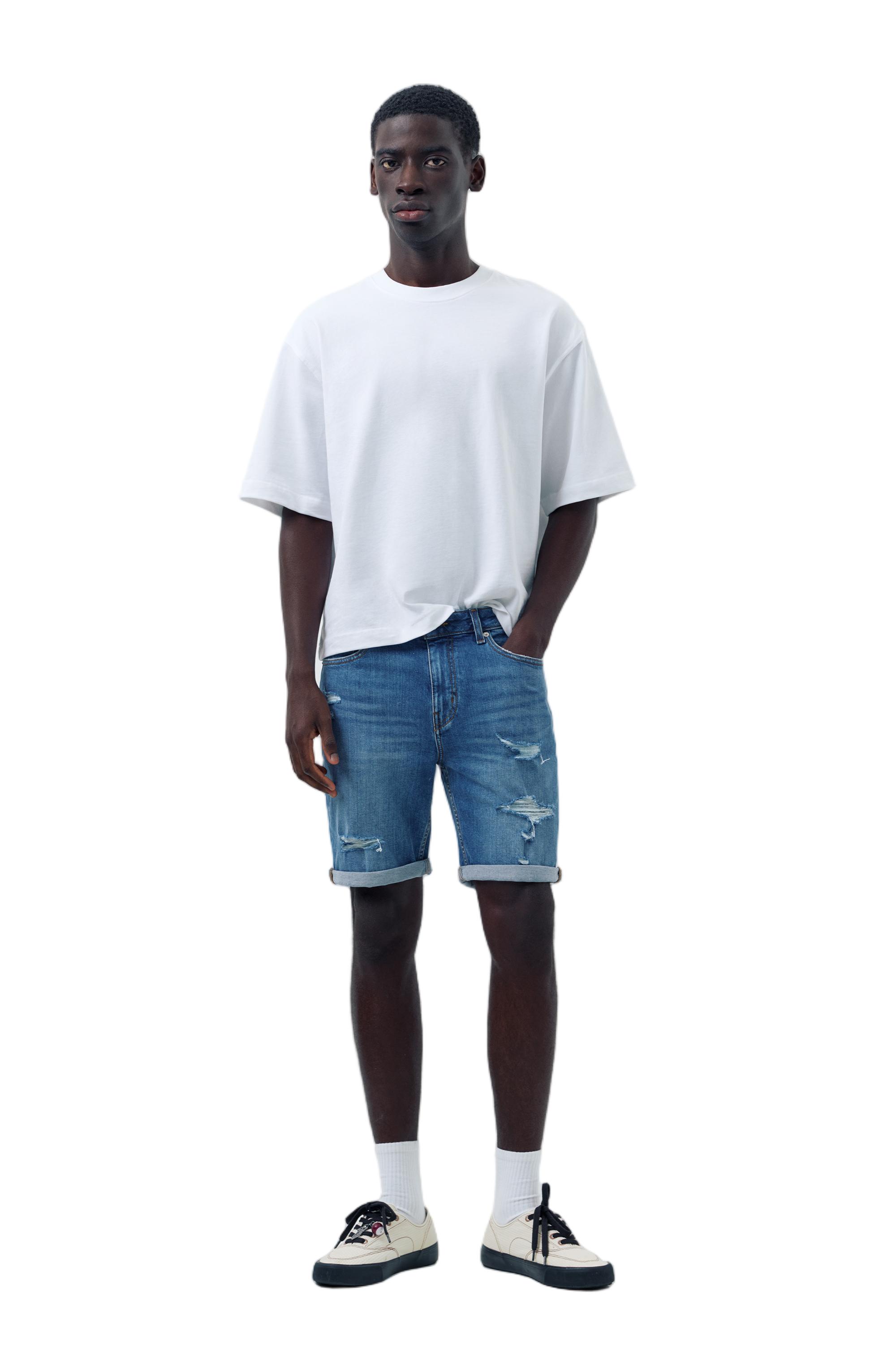 Ripped denim Bermuda shorts — Medium blue