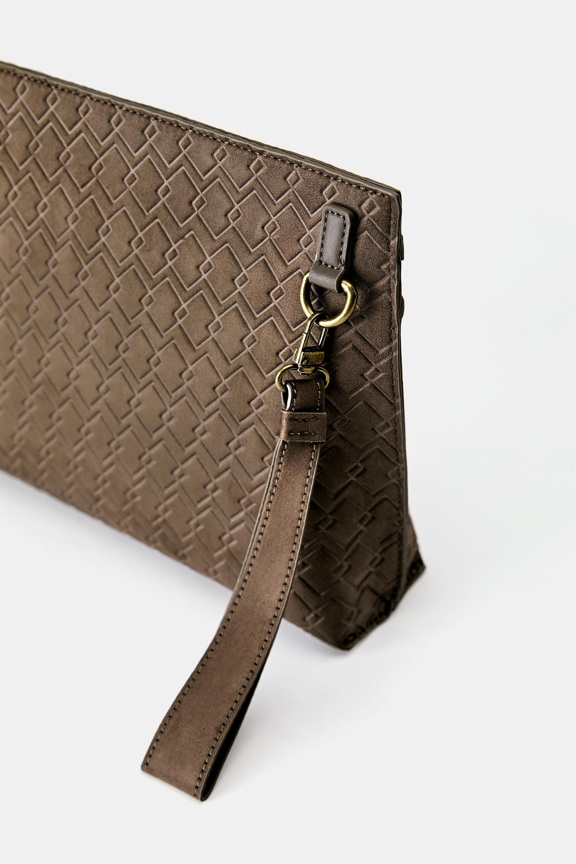 Embossed handle clutch bag — Brown