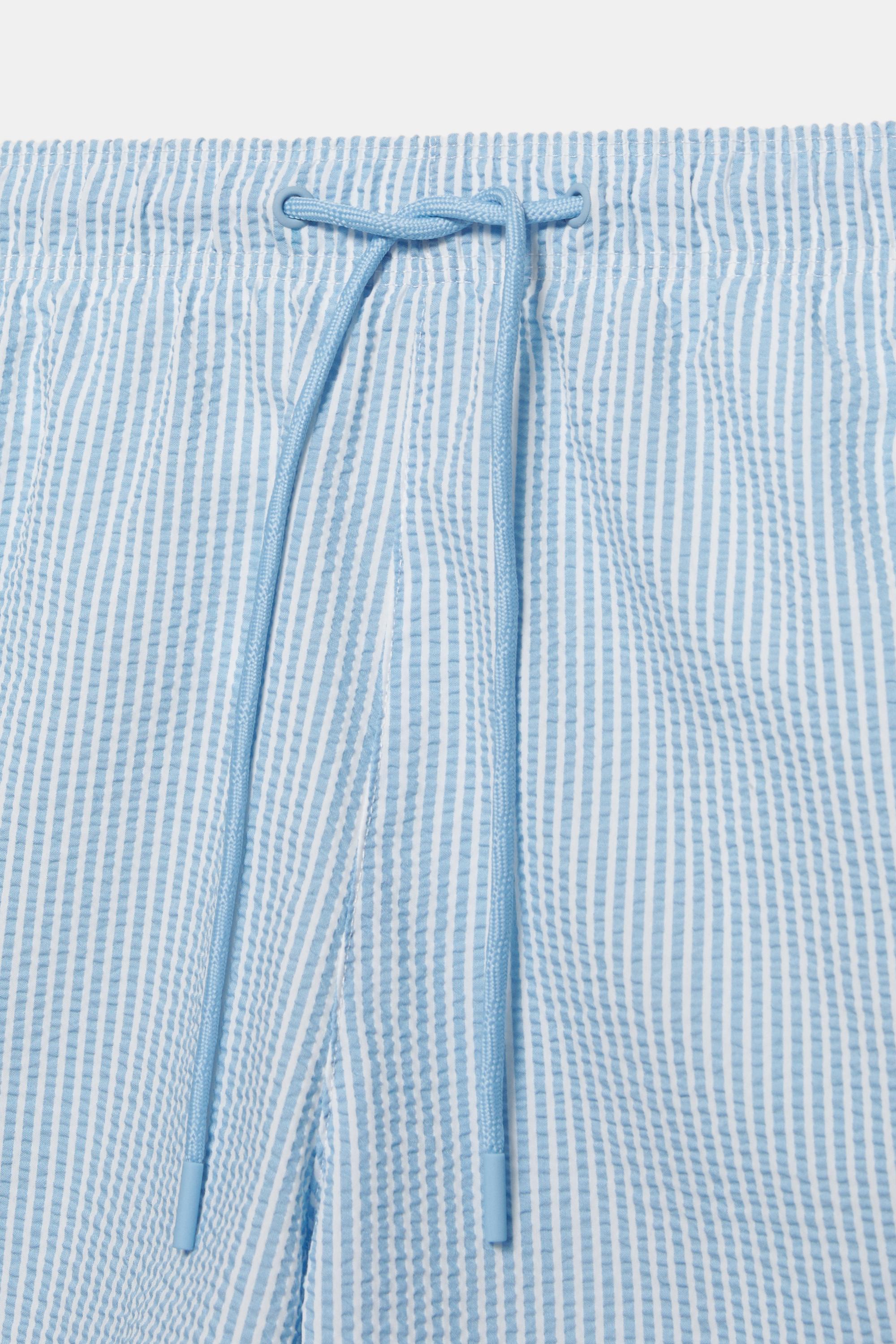 Striped seersucker swimming trunks — Blue
