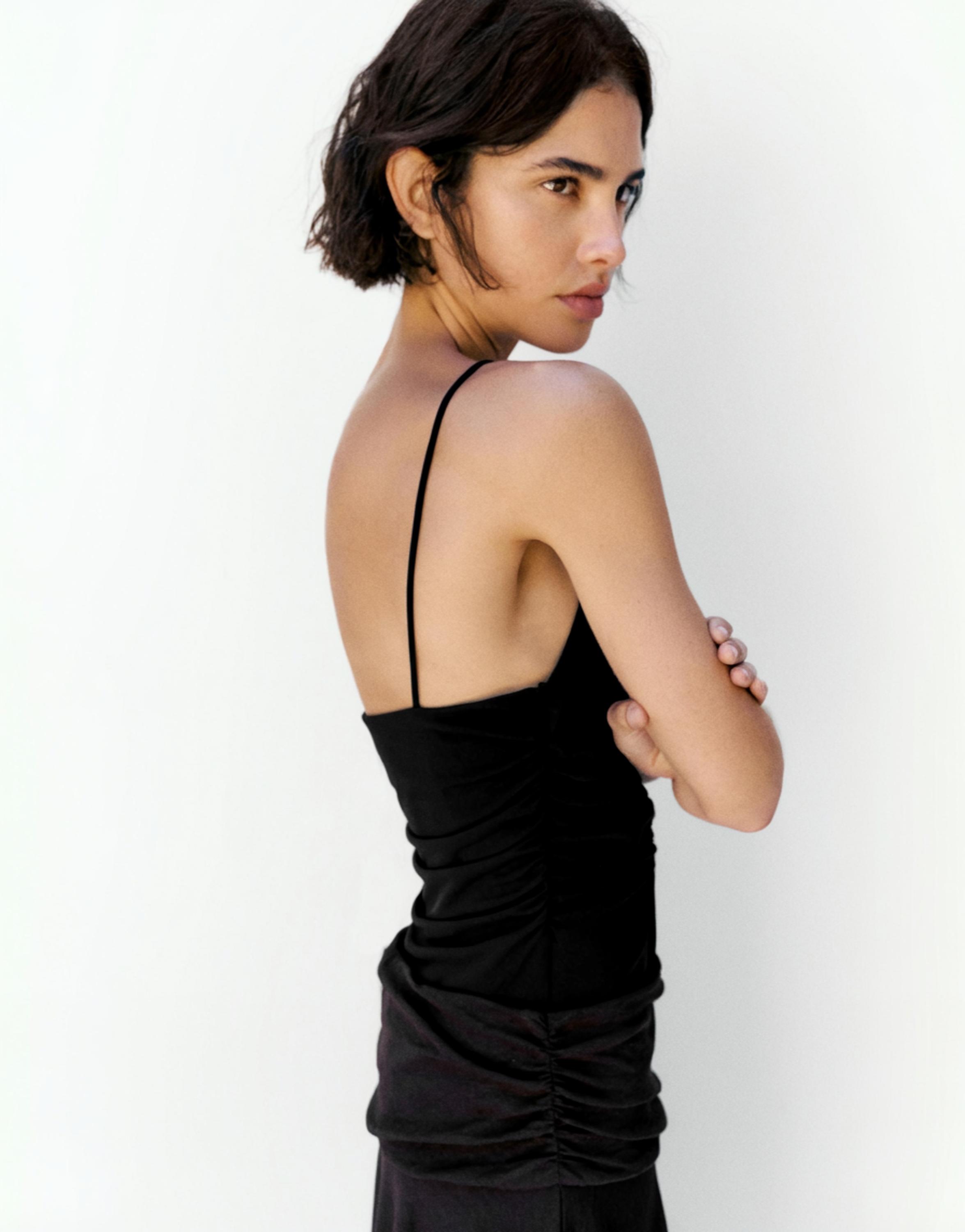 Strappy cut-out bodysuit with appliques — Black